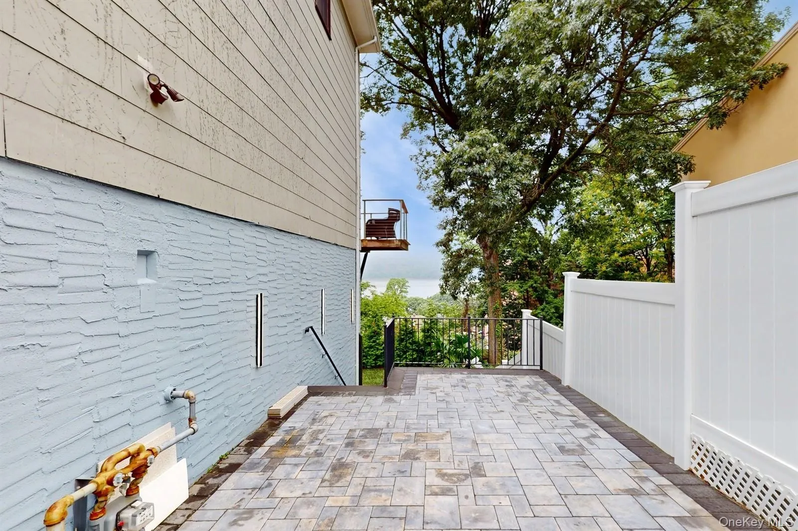 Patio / terrace with new Pavers & Vinyl Fencing. Patio / terrace with new Pavers & Vinyl Fencing.
