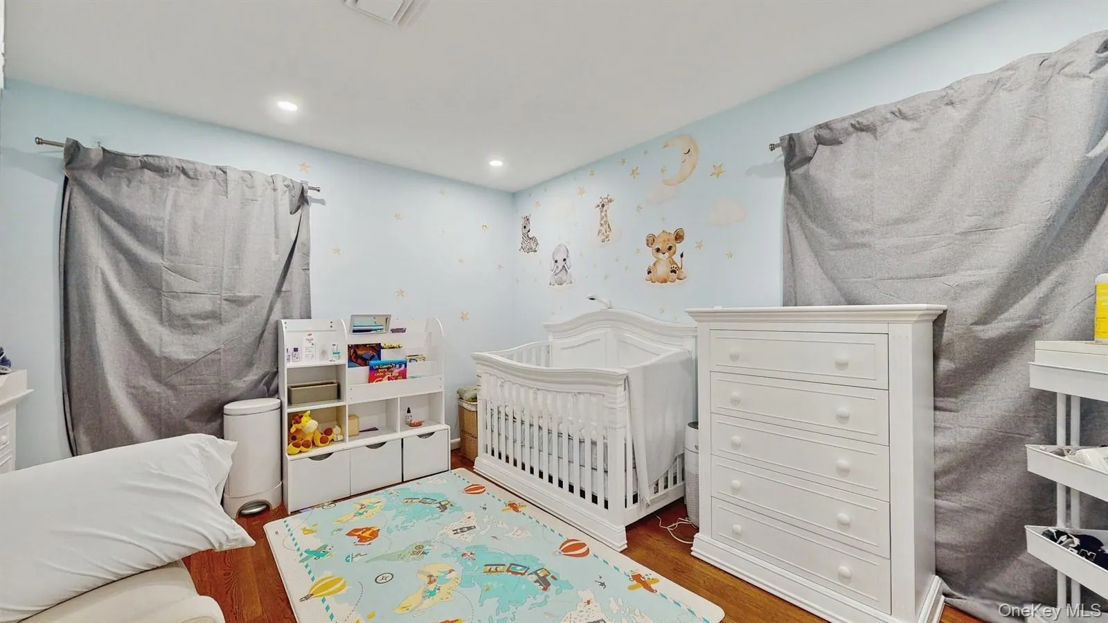 Bedroom featuring wood finished floors, recessed lighting and closet. Bedroom featuring wood finished floors, recessed lighting and closet.