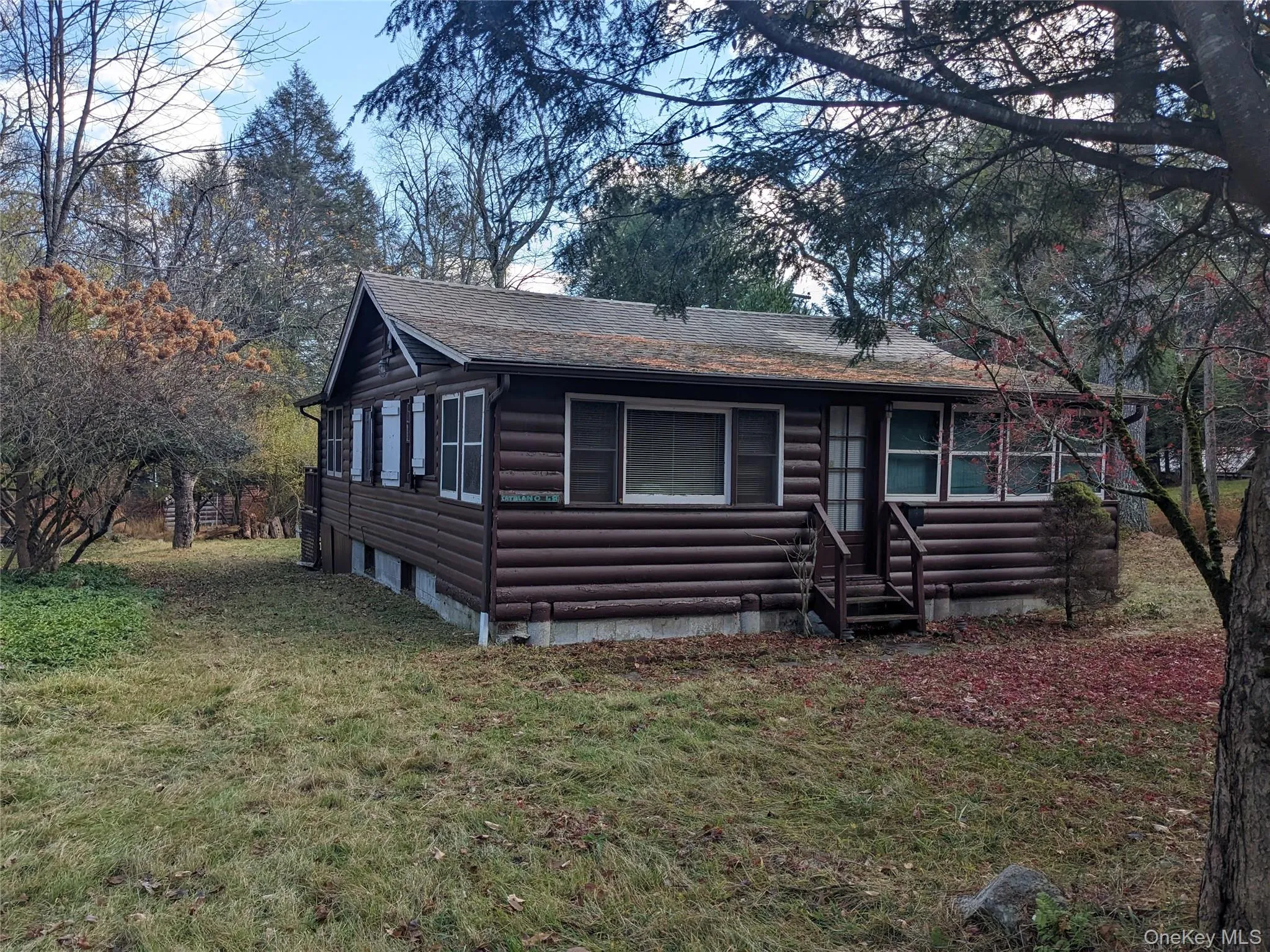 View of front facade featuring log siding View of front facade featuring log siding