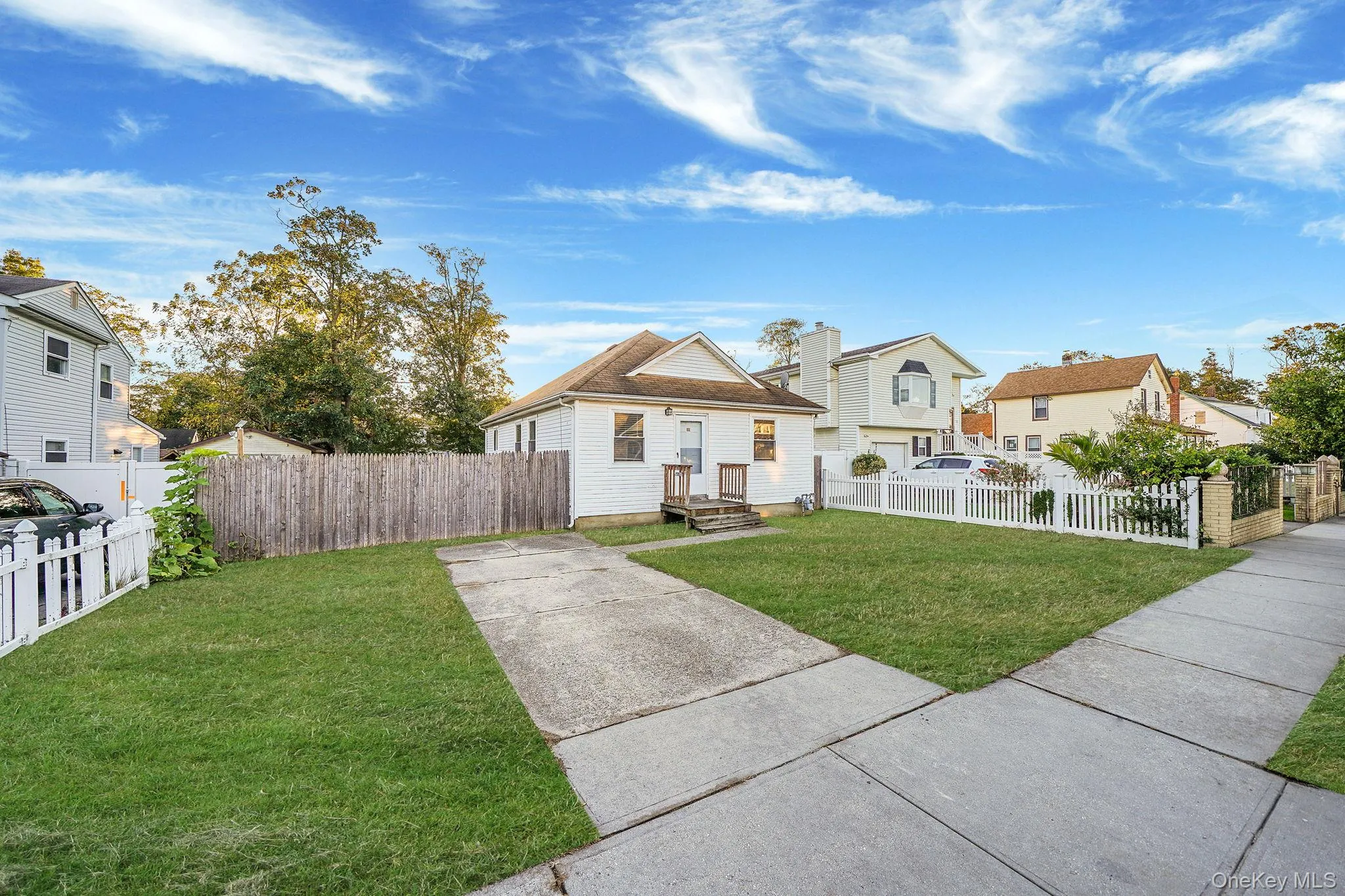 View of front facade with a fenced front yard and a residential view View of front facade with a fenced front yard and a residential view