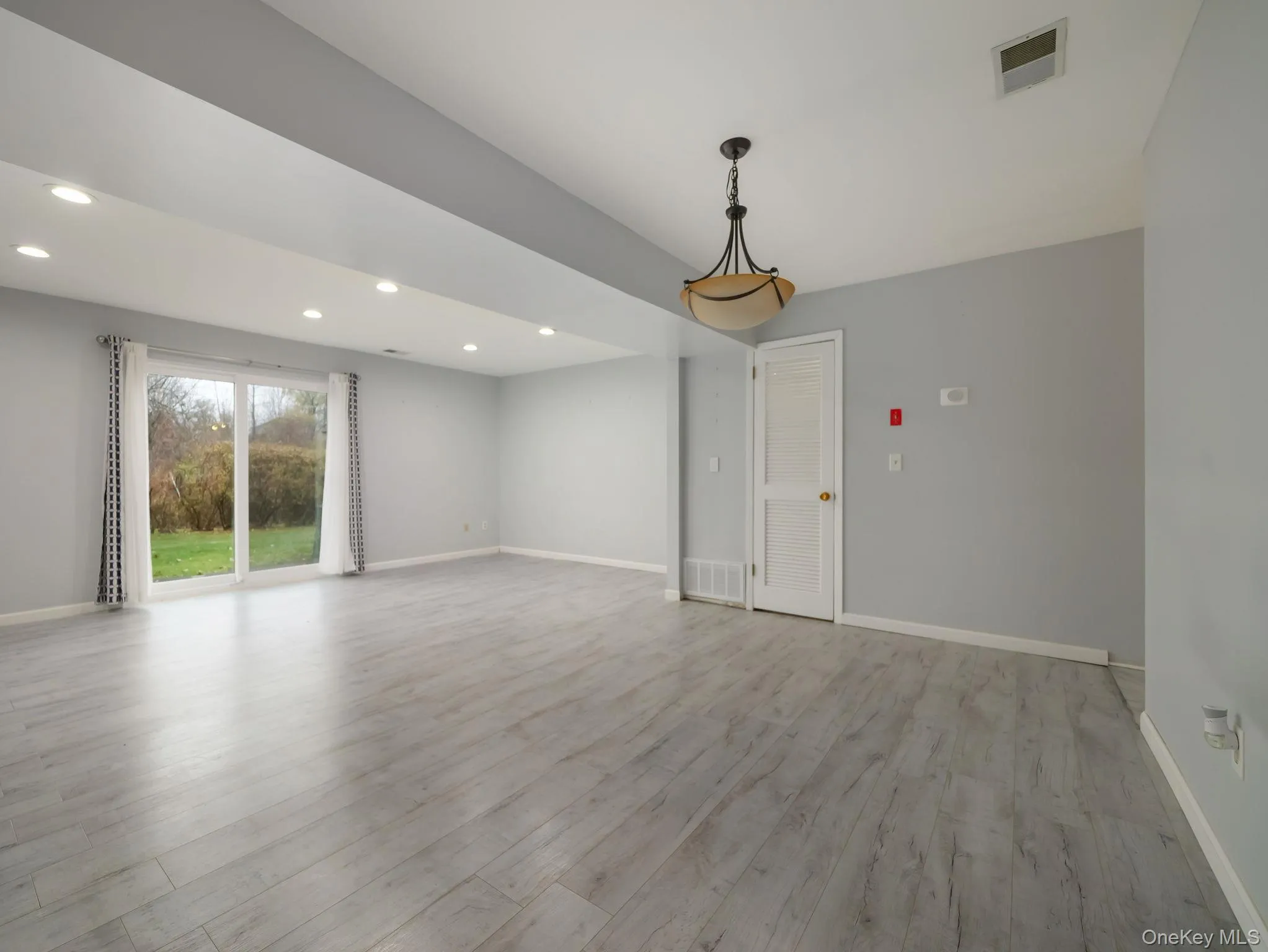 Spare room featuring light wood finished floors and recessed lighting Spare room featuring light wood finished floors and recessed lighting