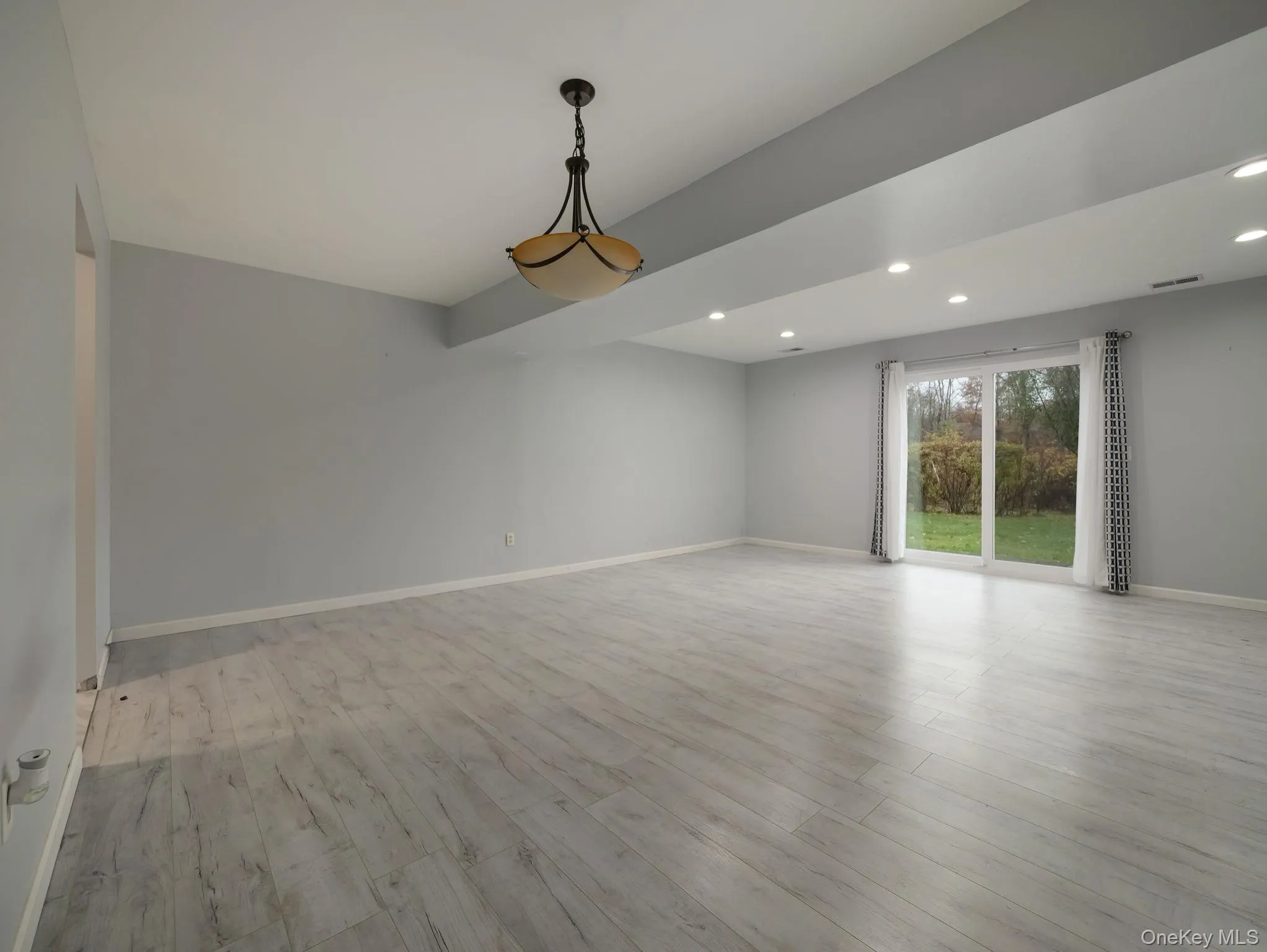 Unfurnished room featuring light wood-style flooring and recessed lighting Unfurnished room featuring light wood-style flooring and recessed lighting