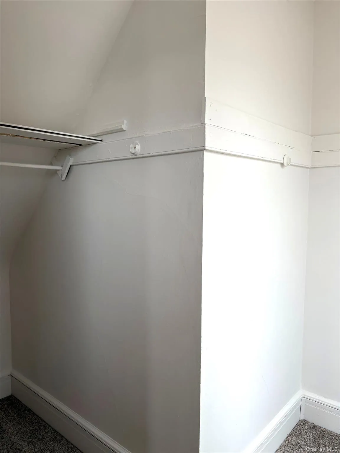 Spacious closet featuring carpet floors Spacious closet featuring carpet floors