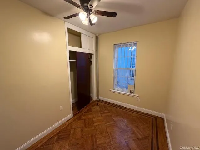 Unfurnished bedroom featuring a ceiling fan and a closet Unfurnished bedroom featuring a ceiling fan and a closet