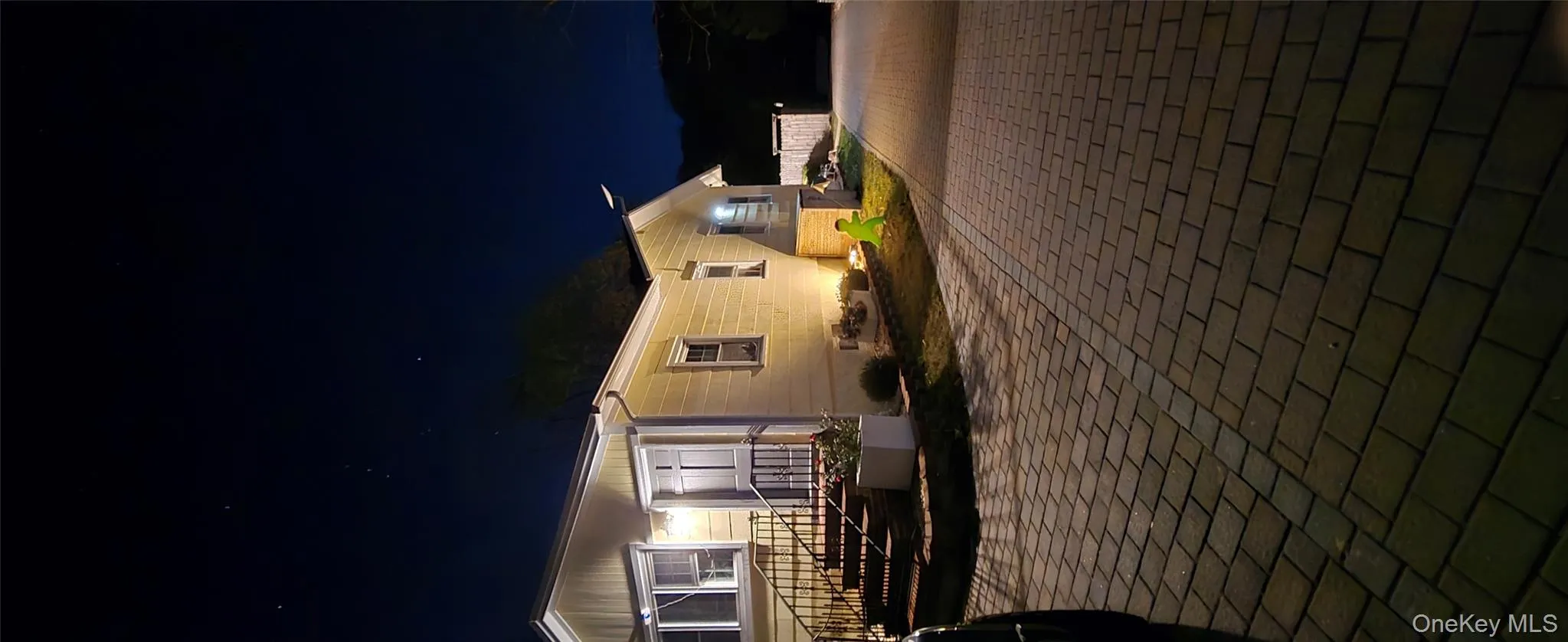 View of front facade with decorative driveway View of front facade with decorative driveway