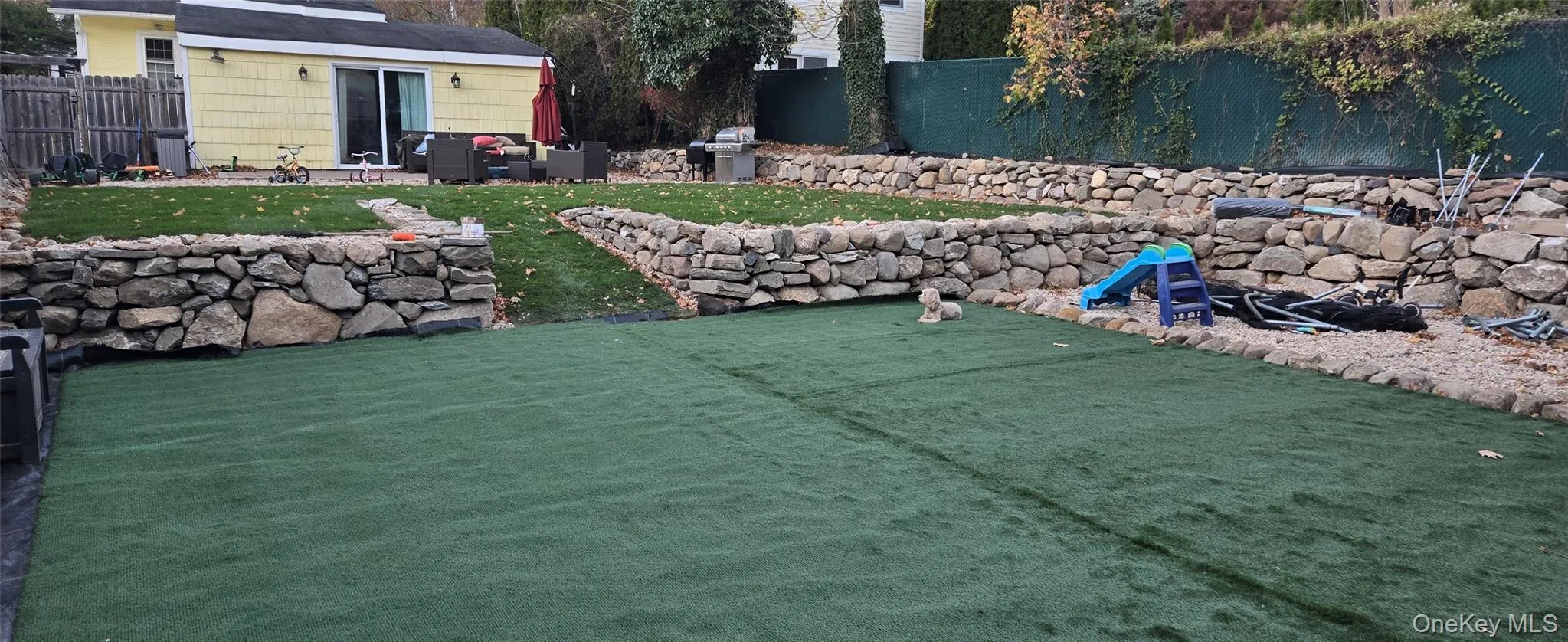 Fenced backyard featuring a patio Fenced backyard featuring a patio