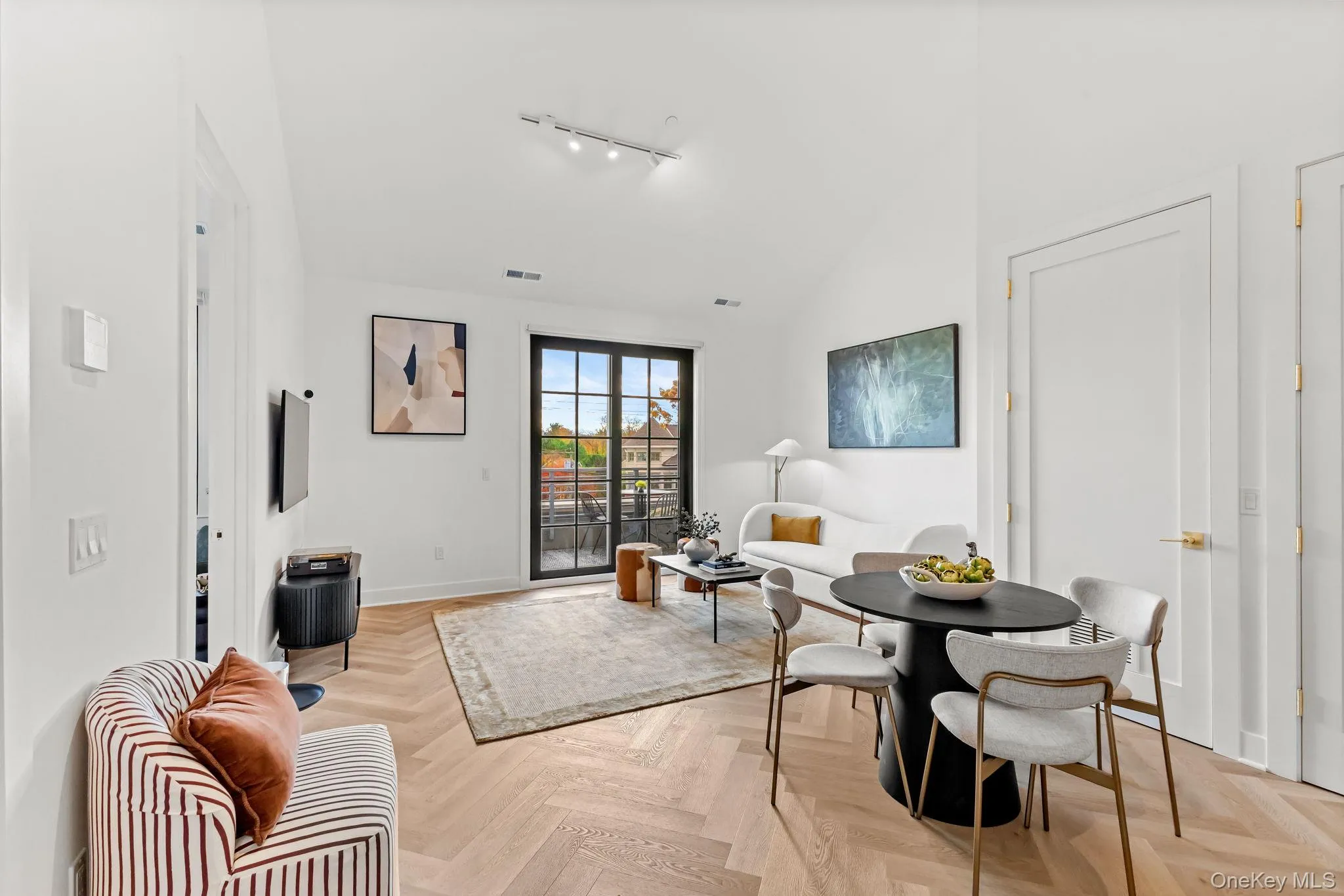 Dining room with baseboards and track lighting Dining room with baseboards and track lighting