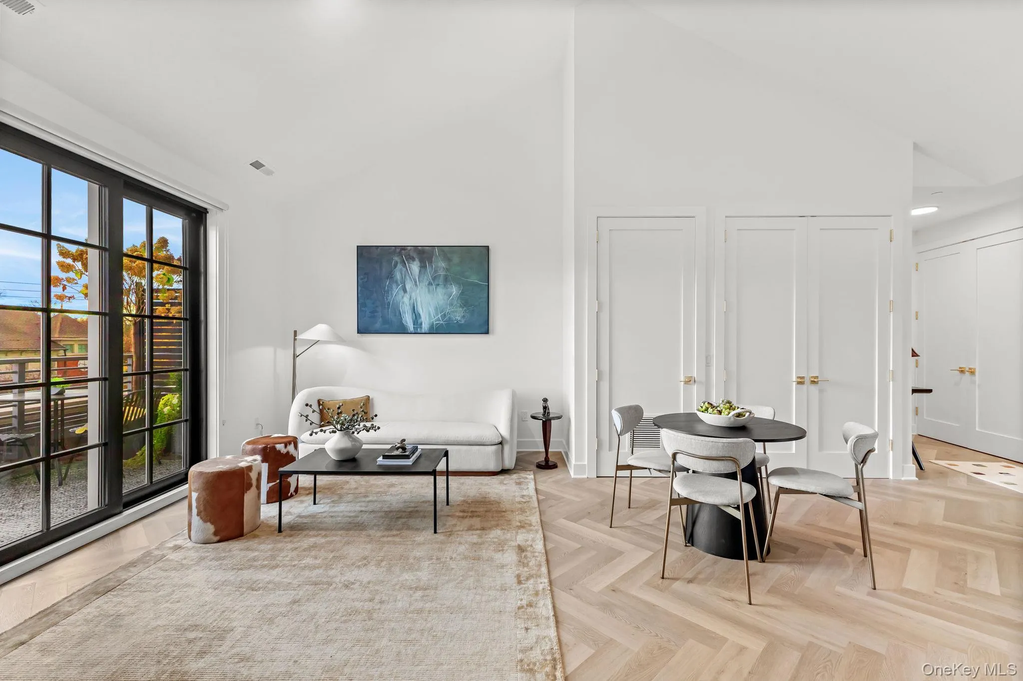 Living area featuring high vaulted ceiling Living area featuring high vaulted ceiling