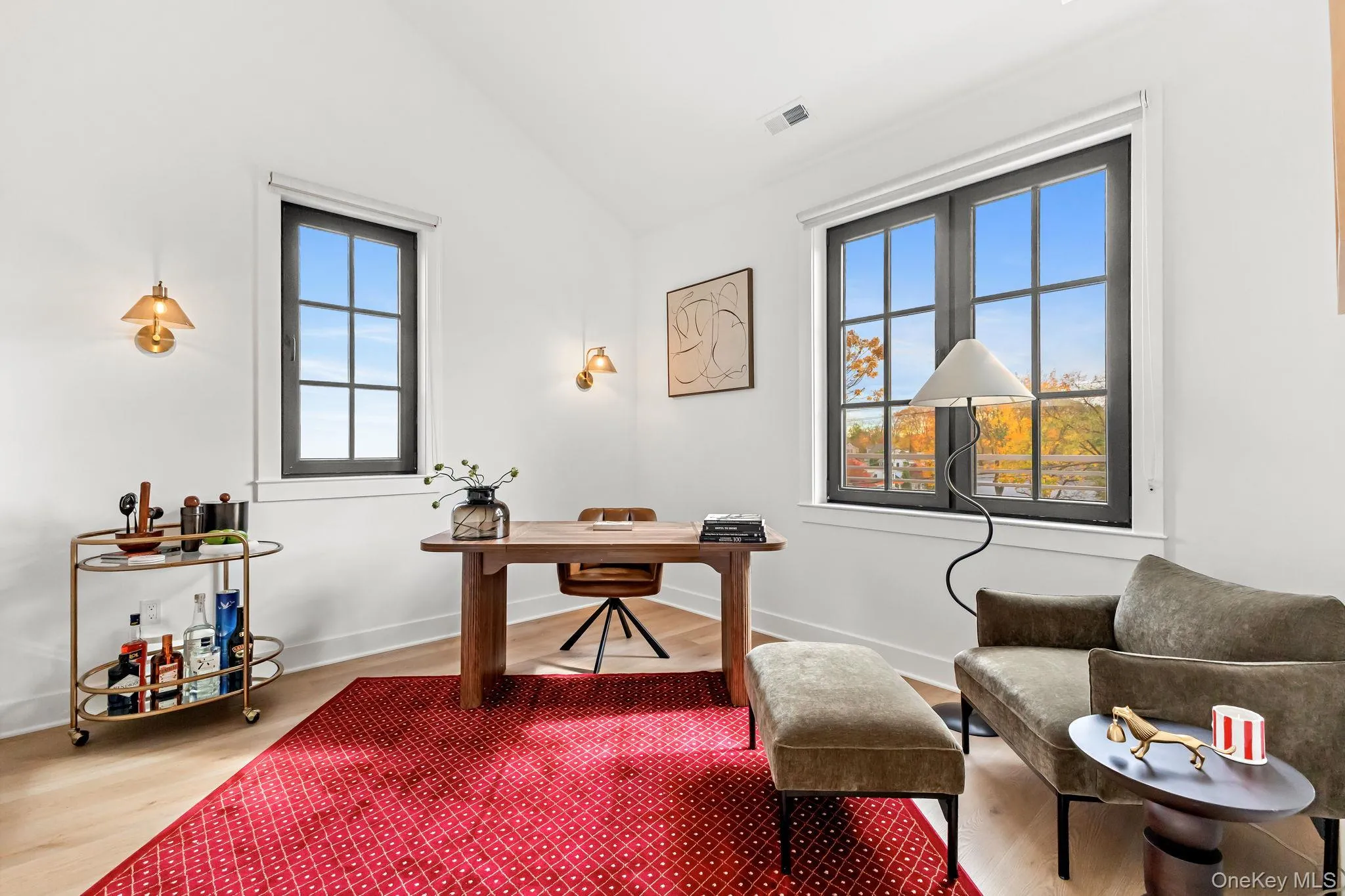 Office featuring vaulted ceiling and wood finished floors Office featuring vaulted ceiling and wood finished floors