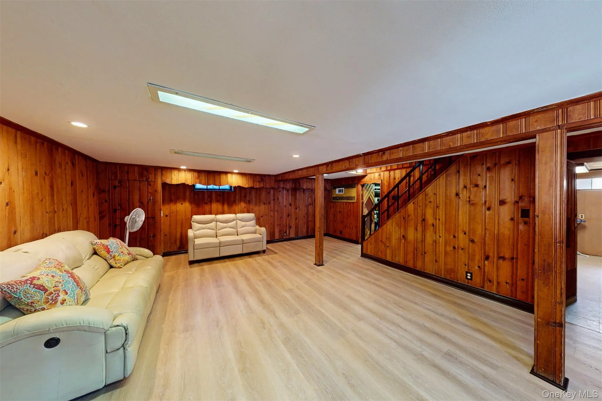 Living area featuring wood walls, recessed lighting Living area featuring wood walls, recessed lighting