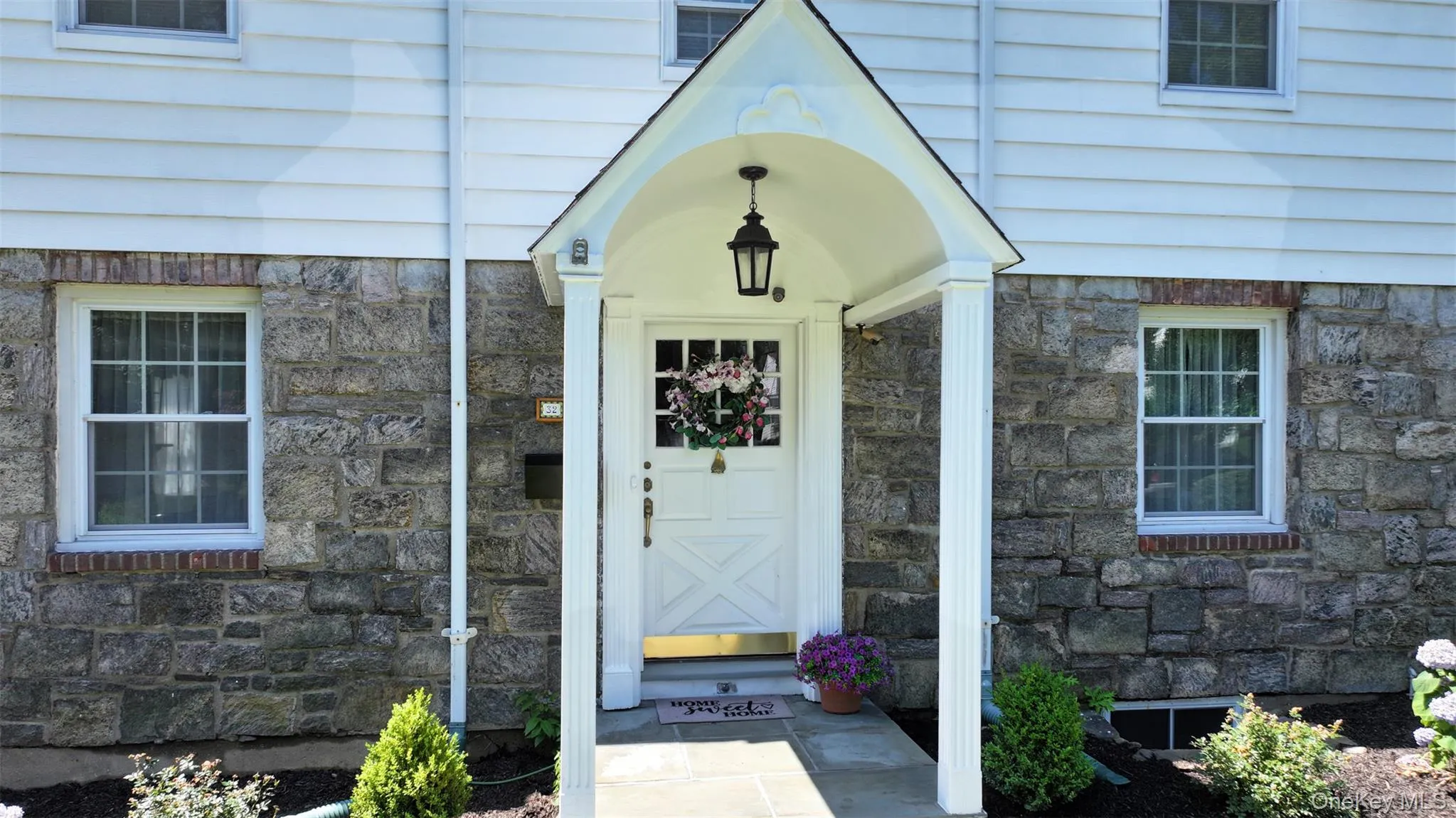 View of exterior entry with stone siding View of exterior entry with stone siding
