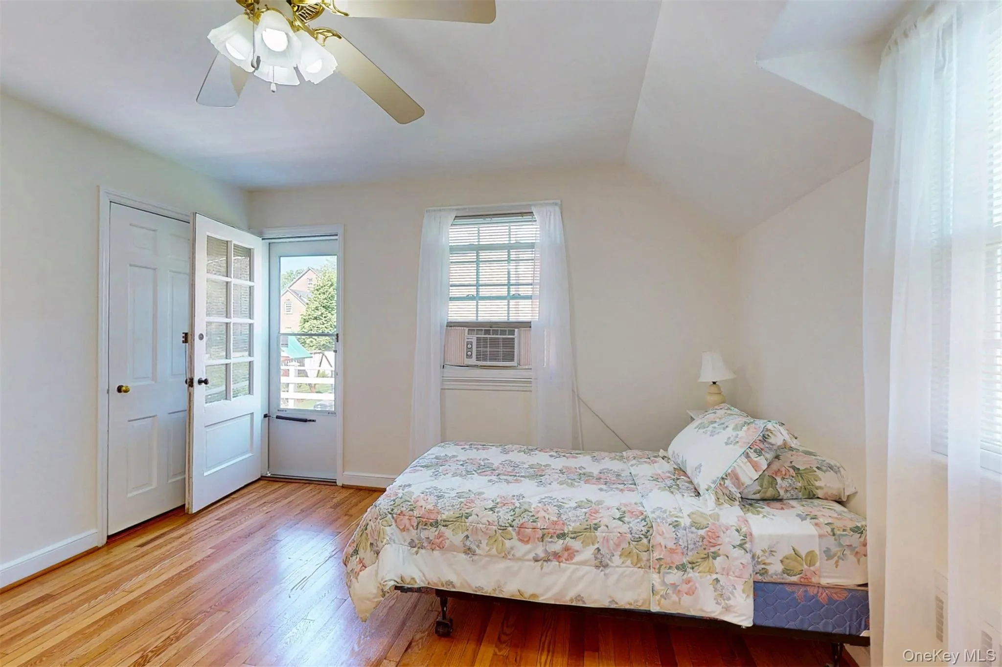 Spacious Bedroom #3 with door out to large deck which overlooks backyard/pool Spacious Bedroom #3 with door out to large deck which overlooks backyard/pool