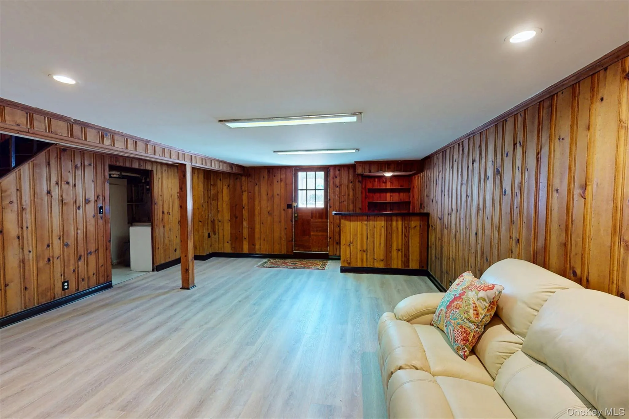 Spacious recreation with door to pool/backyard and bar, and door to finished laundry room Spacious recreation with door to pool/backyard and bar, and door to finished laundry room