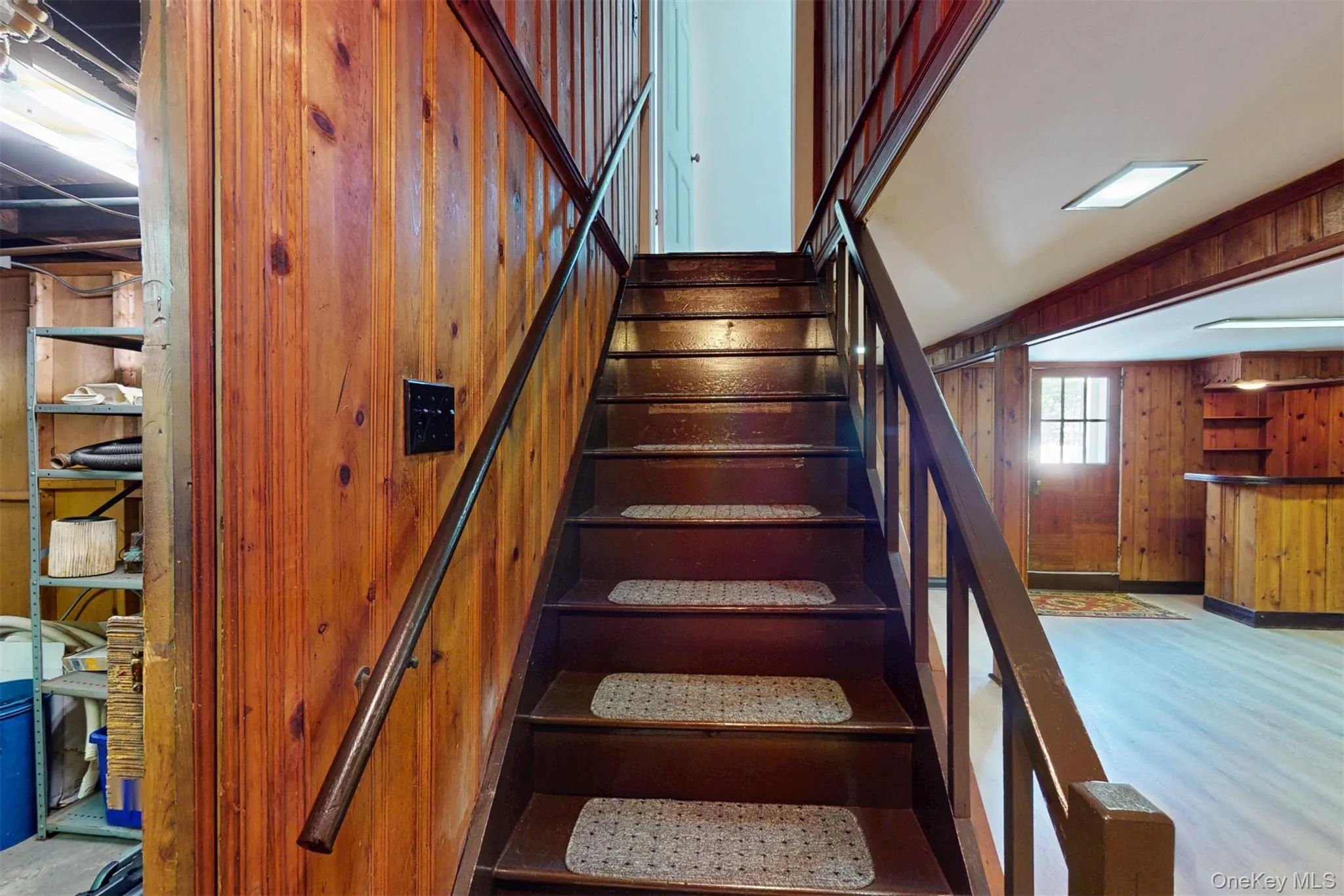 Stairway to basement wood walls and NEW laminate wood looking floors Stairway to basement wood walls and NEW laminate wood looking floors