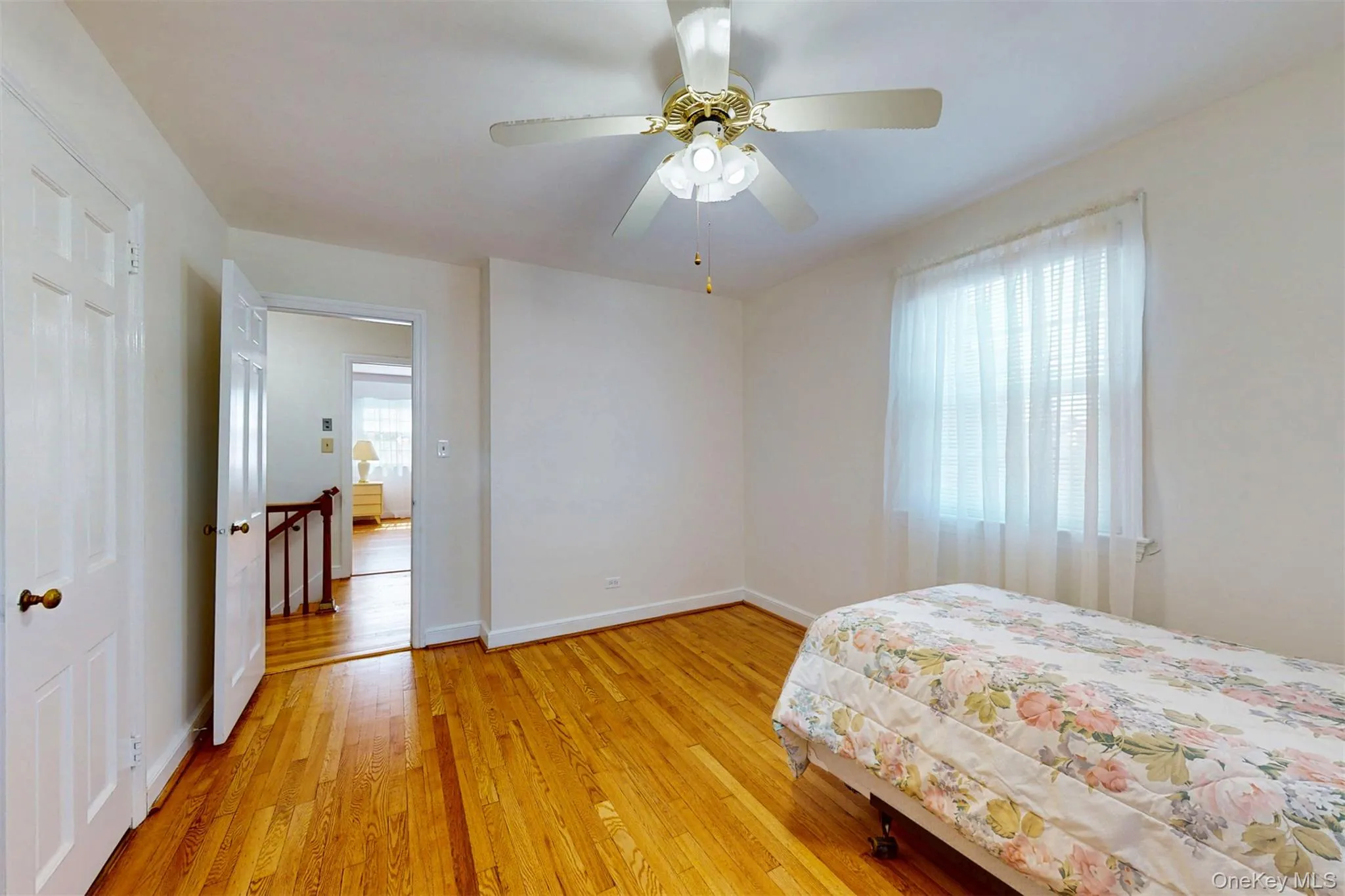 Bedroom #2 with hardwood floors and a ceiling fan, large closet Bedroom #2 with hardwood floors and a ceiling fan, large closet