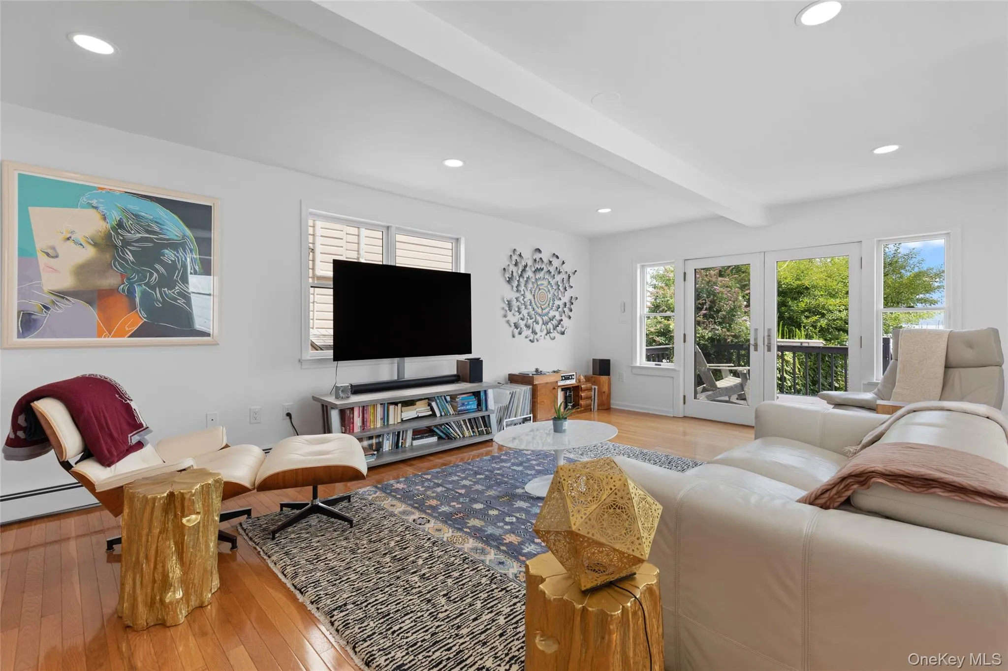 Living area featuring beamed ceiling, hardwood / wood-style flooring, and recessed lighting Living area featuring beamed ceiling, hardwood / wood-style flooring, and recessed lighting