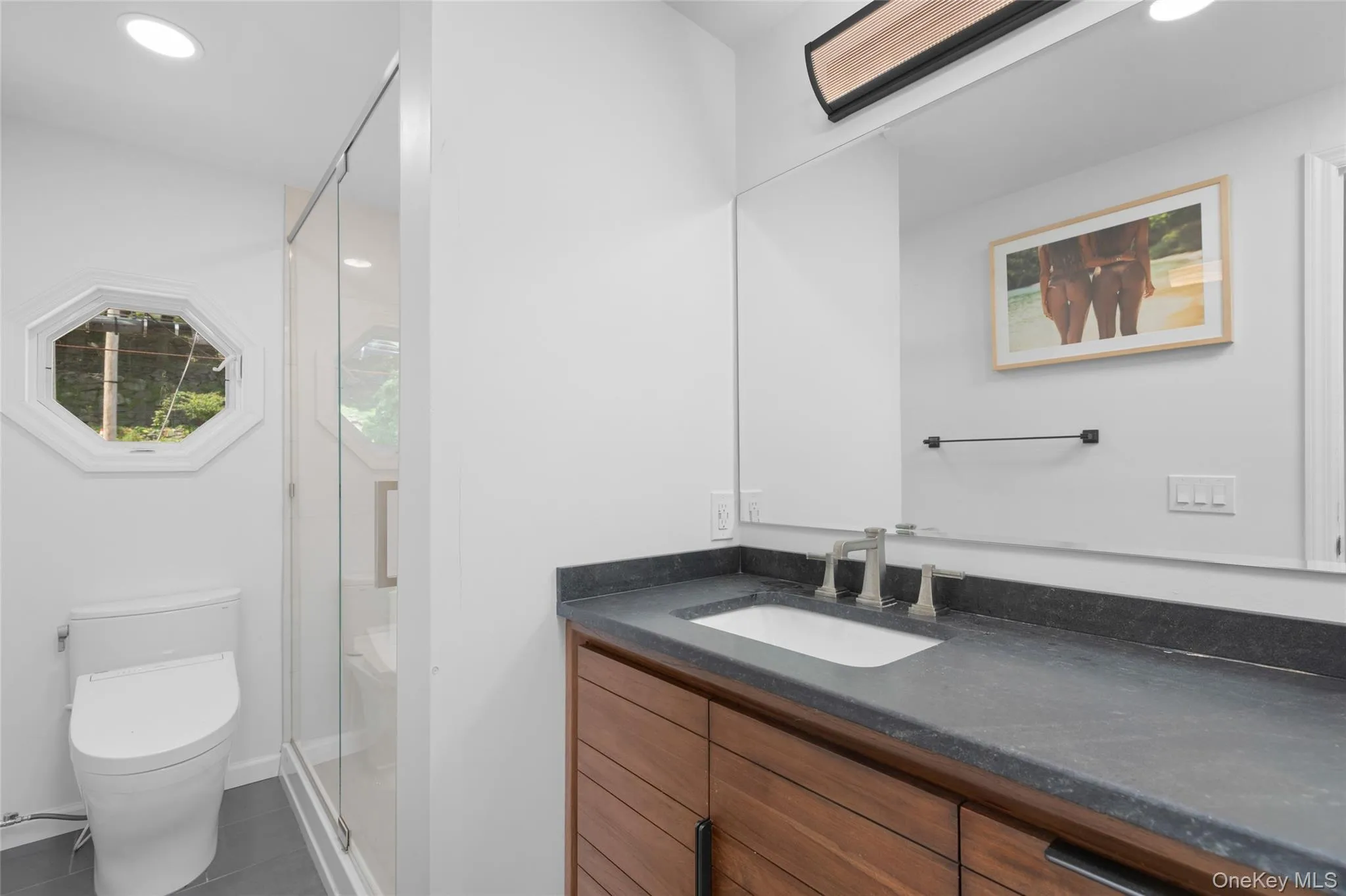 Full bath with vanity, a shower stall, recessed lighting, and tile patterned floors Full bath with vanity, a shower stall, recessed lighting, and tile patterned floors