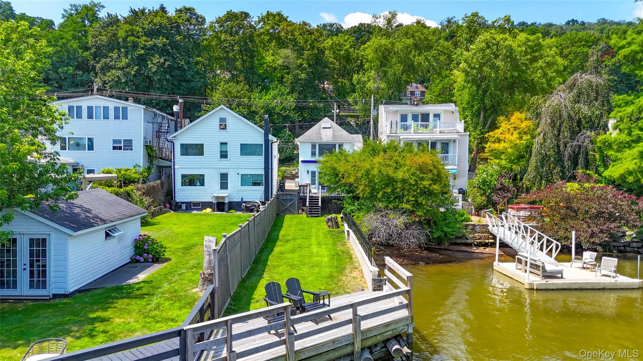 Aerial perspective of suburban area featuring a large body of water Aerial perspective of suburban area featuring a large body of water
