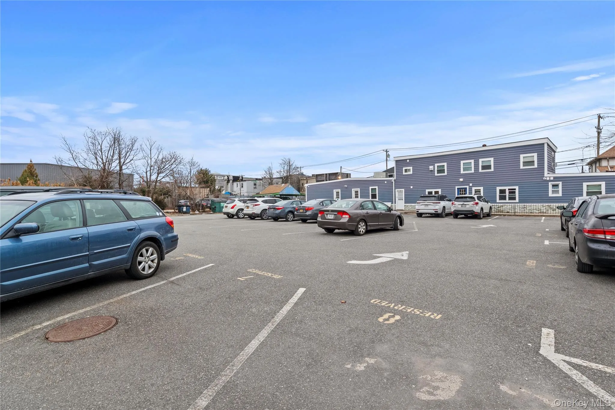 Uncovered parking lot with a residential view Uncovered parking lot with a residential view
