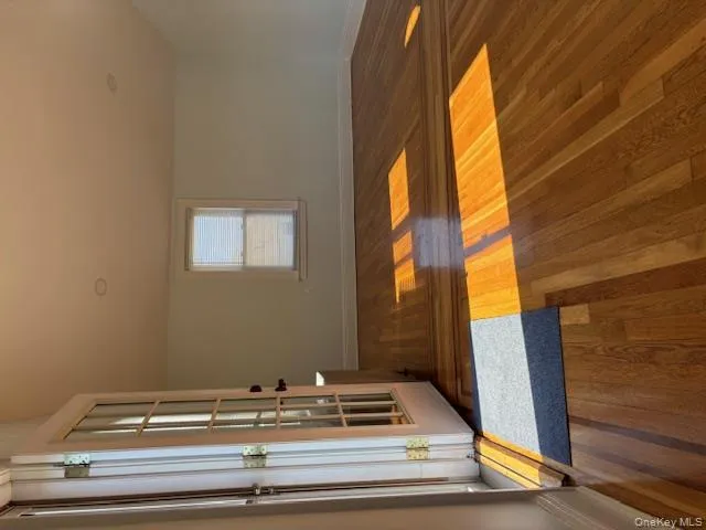 Foyer featuring dark wood-style flooring and baseboards Foyer featuring dark wood-style flooring and baseboards
