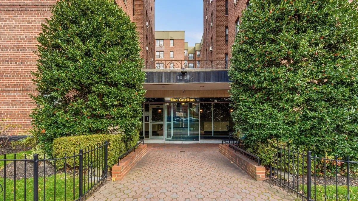 Property entrance with a patio and brick siding Property entrance with a patio and brick siding
