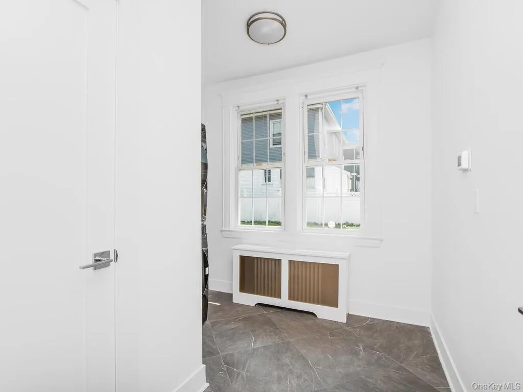 Spare room with radiator heating unit and baseboards Spare room with radiator heating unit and baseboards