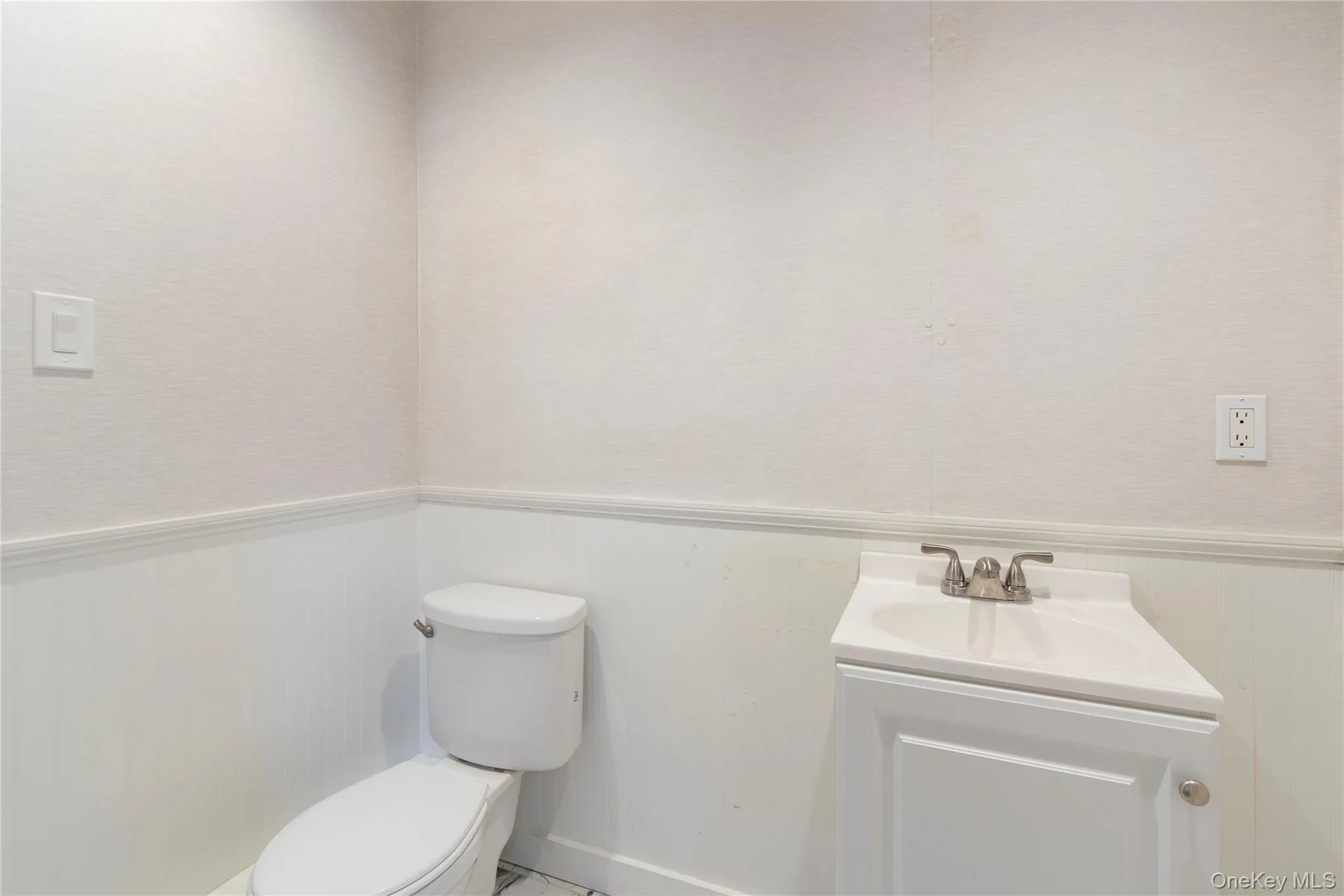 Bathroom with wainscoting and vanity Bathroom with wainscoting and vanity