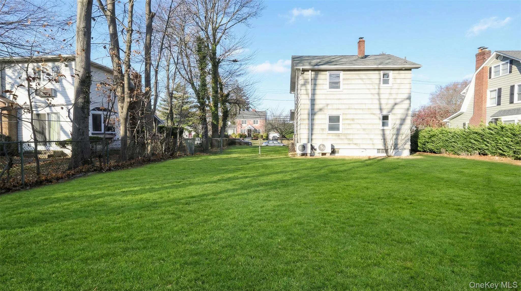 Back of house with a chimney Back of house with a chimney