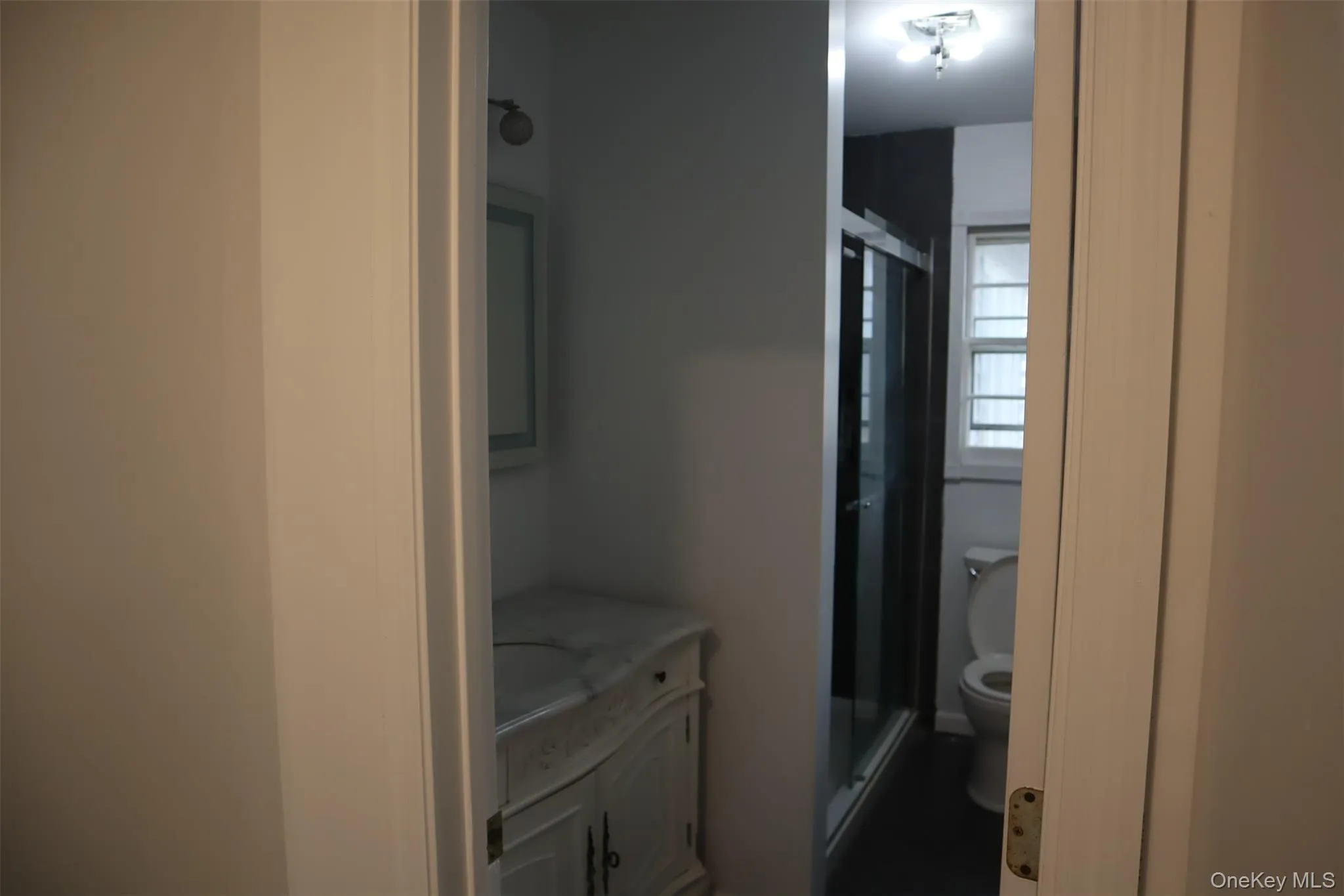 Full bath with vanity and a stall shower Full bath with vanity and a stall shower