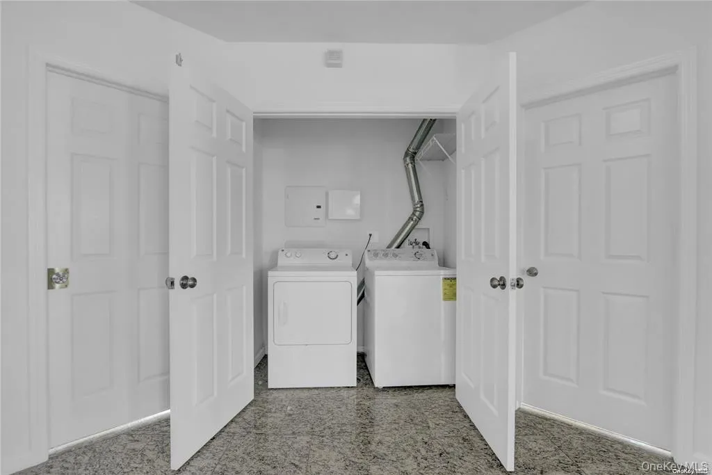 Laundry area with washing machine and dryer Laundry area with washing machine and dryer