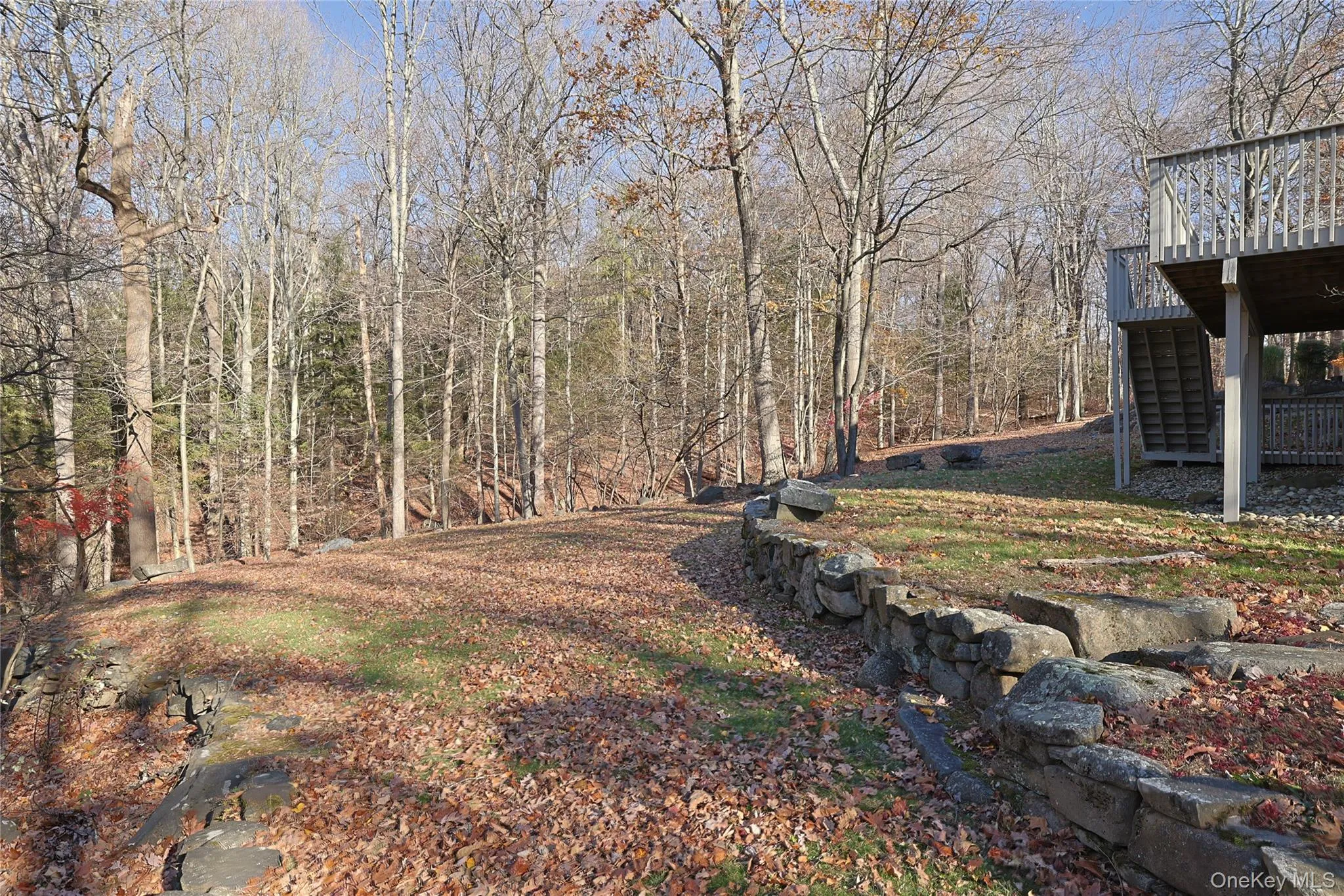 View of grassy yard featuring stairs View of grassy yard featuring stairs