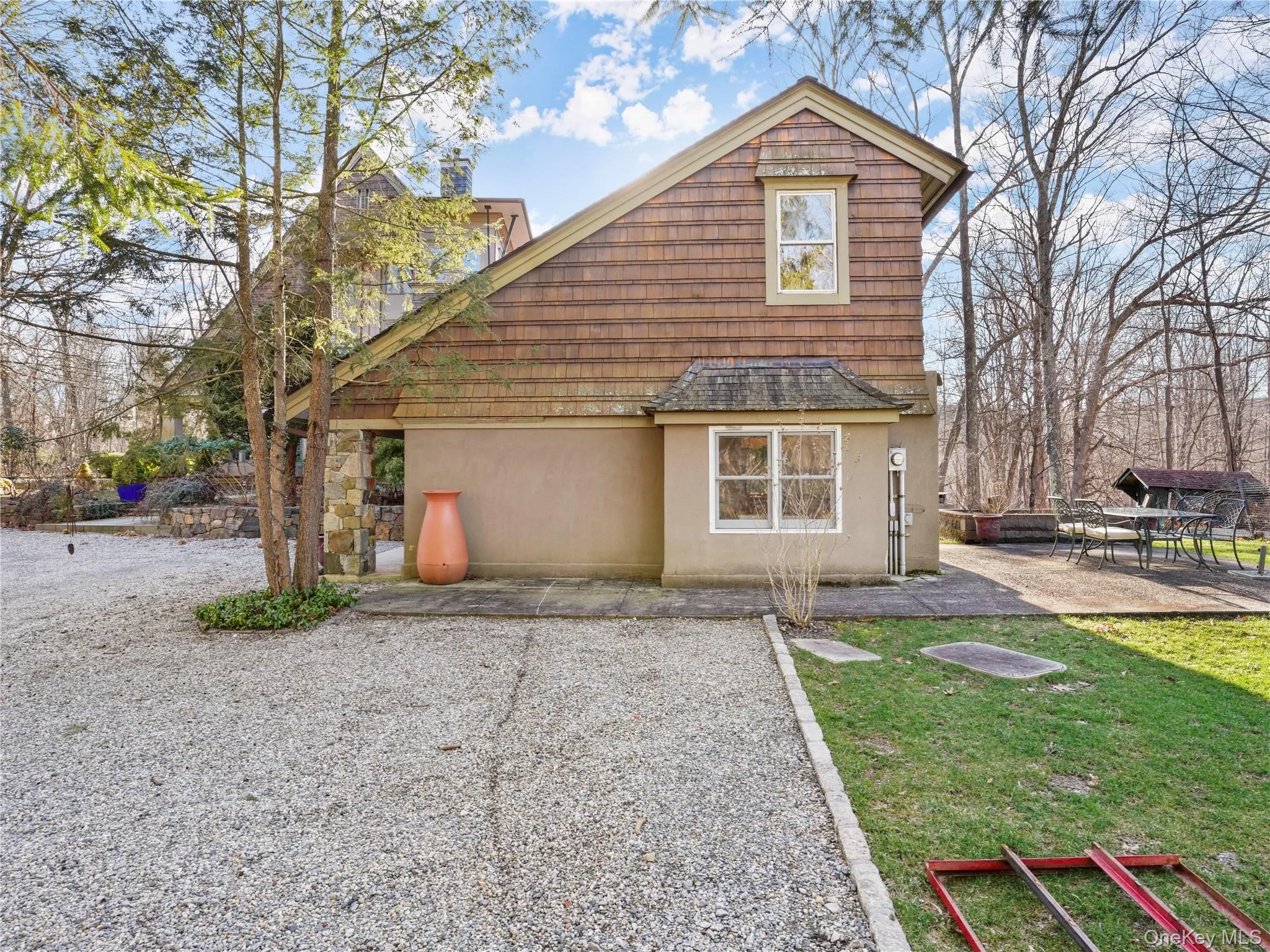 Back of property featuring stucco siding, a yard, and a patio Back of property featuring stucco siding, a yard, and a patio