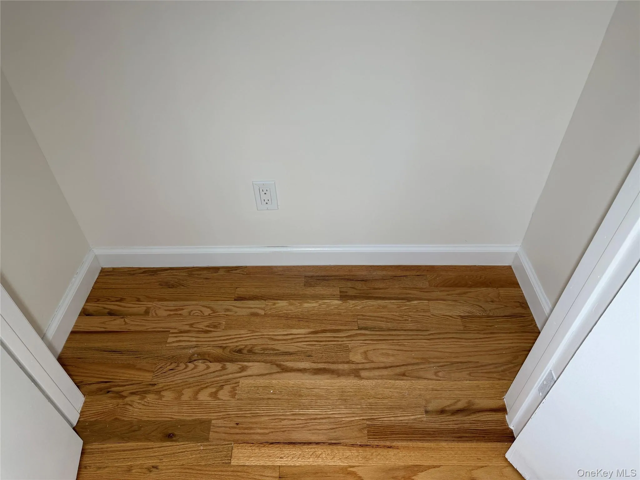 Detailed view of wood finished floors and baseboards Detailed view of wood finished floors and baseboards