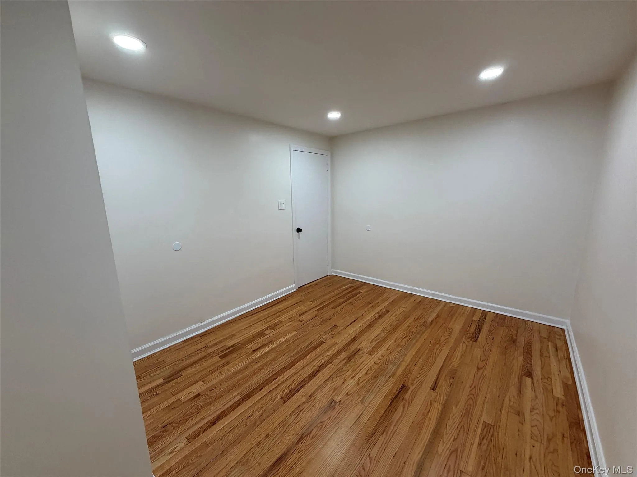 Unfurnished room featuring light wood-style flooring and recessed lighting Unfurnished room featuring light wood-style flooring and recessed lighting