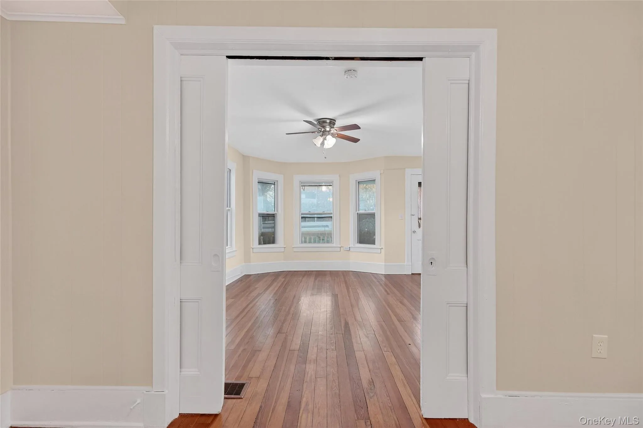 Spare room featuring hardwood / wood-style floors and a ceiling fan Spare room featuring hardwood / wood-style floors and a ceiling fan