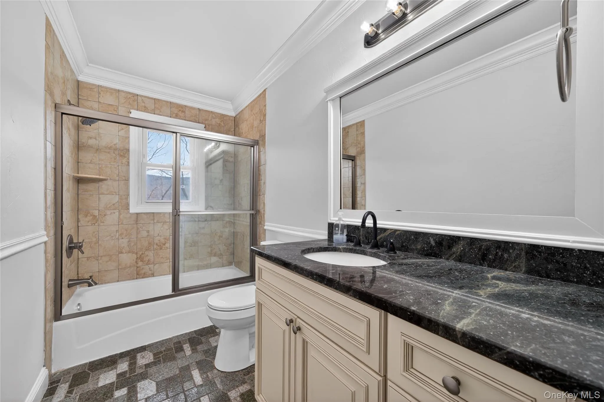 Just down the hall is the main floor full bathroom with tile floors and tub. ALL THREE toilets in the home were replaced in 2026. Just down the hall is the main floor full bathroom with tile floors and tub. ALL THREE toilets in the home were replaced in 2026.