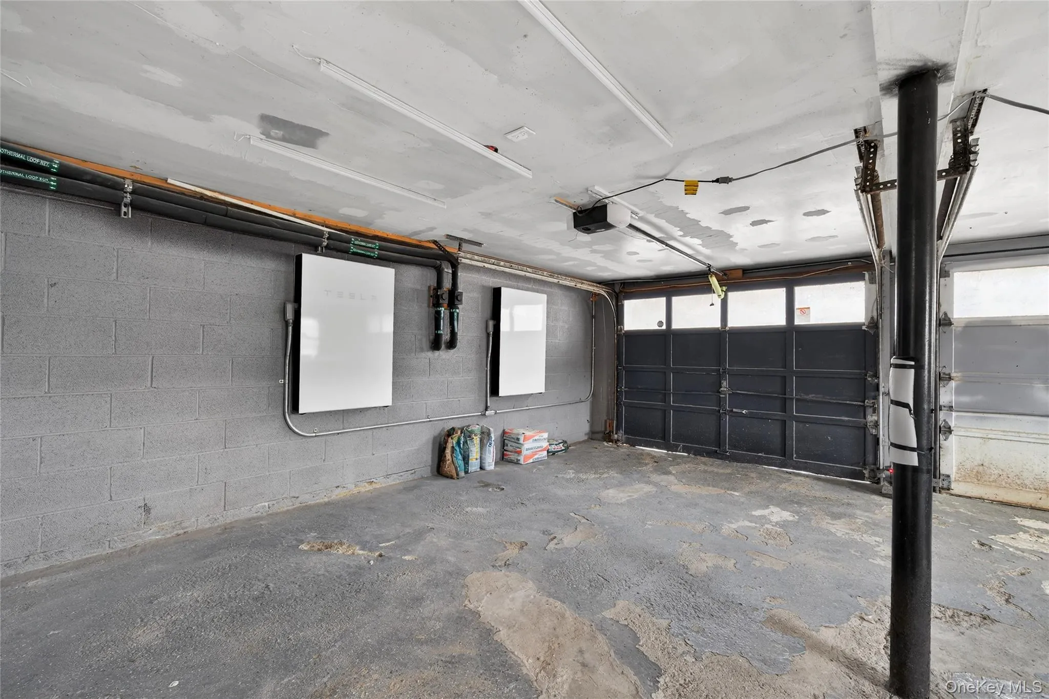 and is adjacent to two-car garage both with electric openers... this is also where the Tesla batteries are mounted... and is adjacent to two-car garage both with electric openers... this is also where the Tesla batteries are mounted...