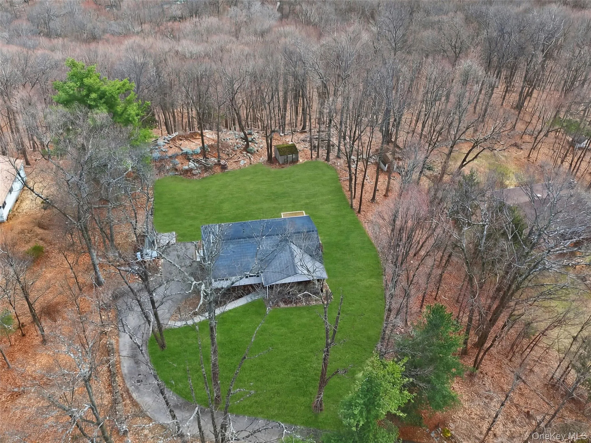 a premium Tesla-powered solar shingled roof -- as seen from above. Owned - not leased - this is your built-in ticket to major utility savings. a premium Tesla-powered solar shingled roof -- as seen from above. Owned - not leased - this is your built-in ticket to major utility savings.