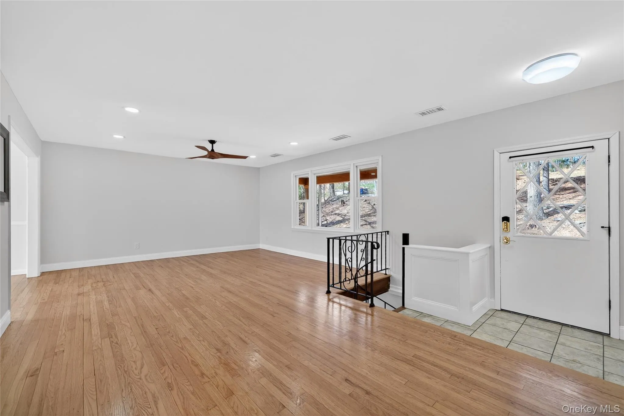 Note the gleaming natural hardwood floors, tiled entry way and spiral stairs to lower level ... Note the gleaming natural hardwood floors, tiled entry way and spiral stairs to lower level ...