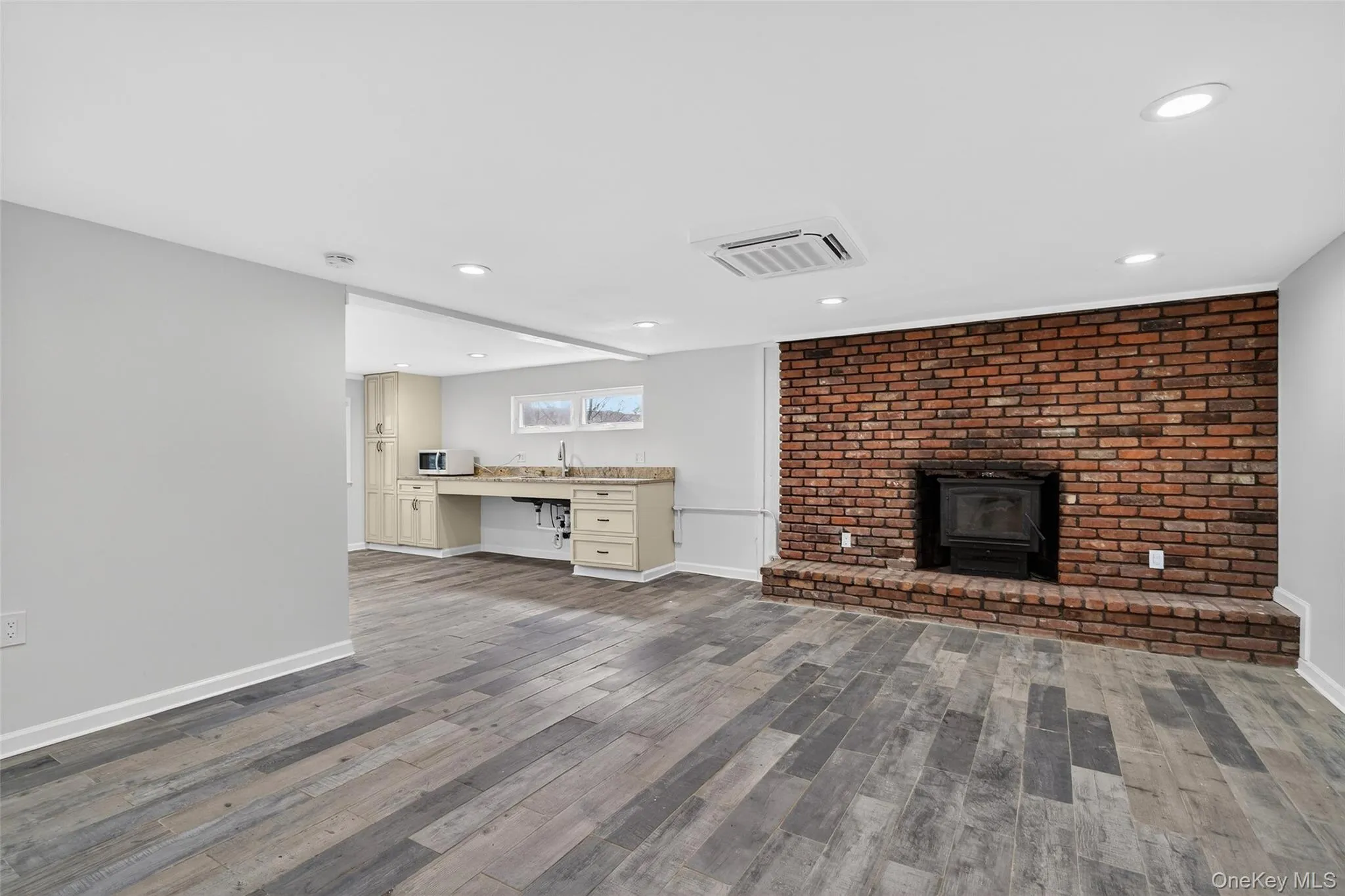 On the fully finished lower basement level is a ton of flex space...please note the fireplace is not currently working... On the fully finished lower basement level is a ton of flex space...please note the fireplace is not currently working...