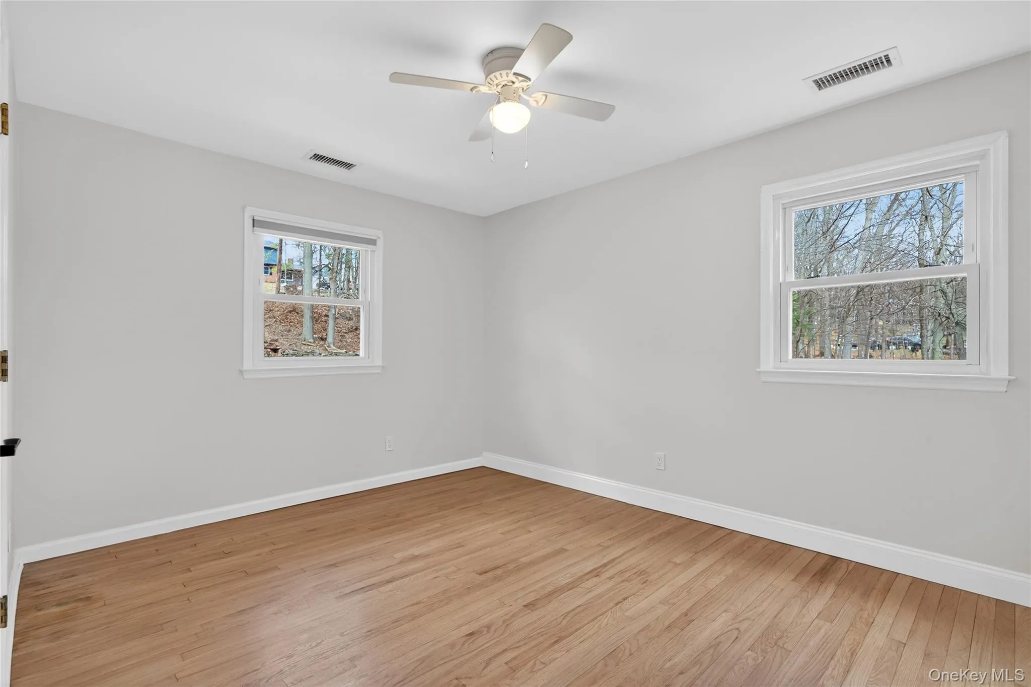 The bedroom on the end has two windows, closet, ceiling fan and hardwood flooring... The bedroom on the end has two windows, closet, ceiling fan and hardwood flooring...