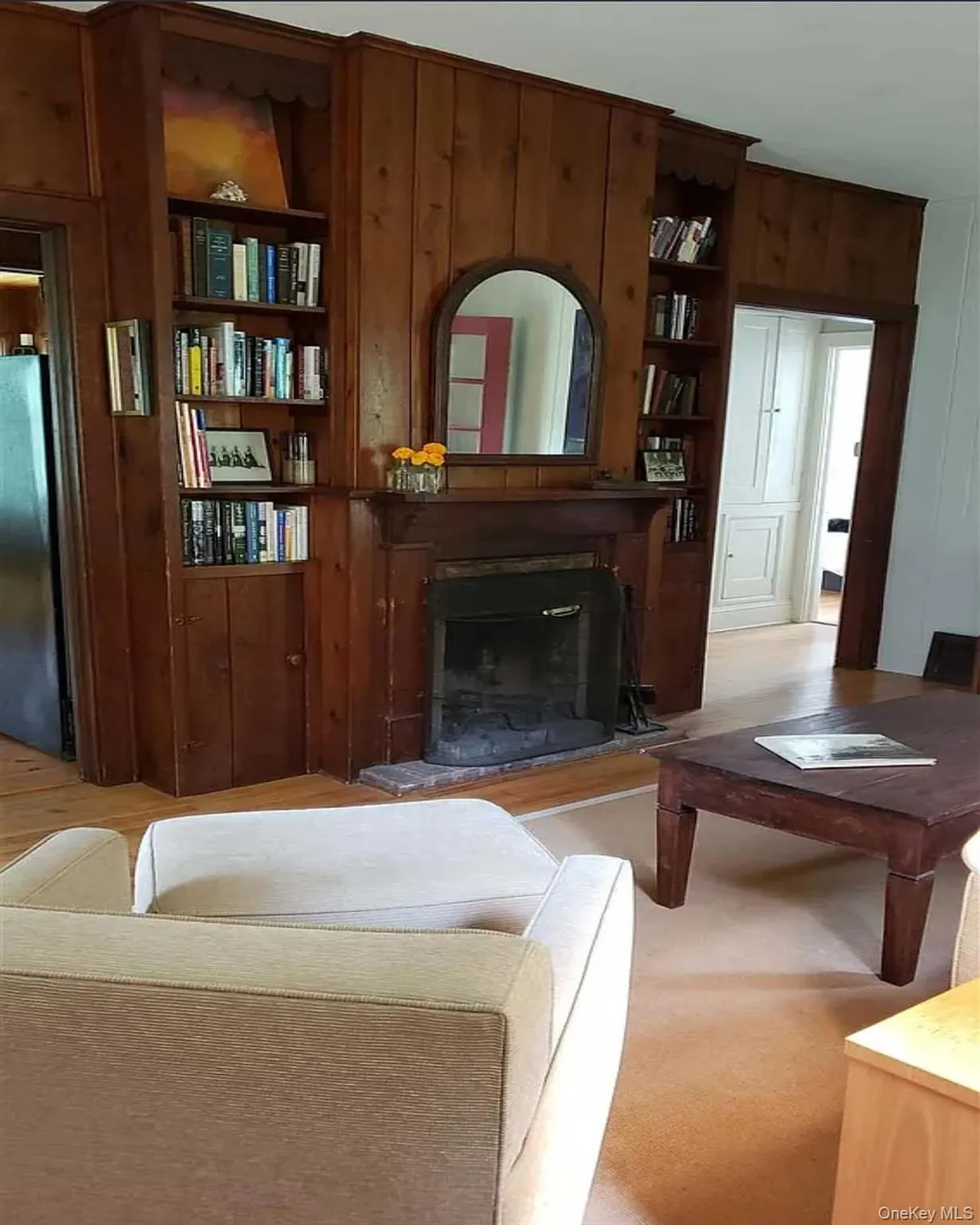 Wrapped in warm pine and centered by a classic fireplace (non-working), this room radiates cottage comfort Wrapped in warm pine and centered by a classic fireplace (non-working), this room radiates cottage comfort