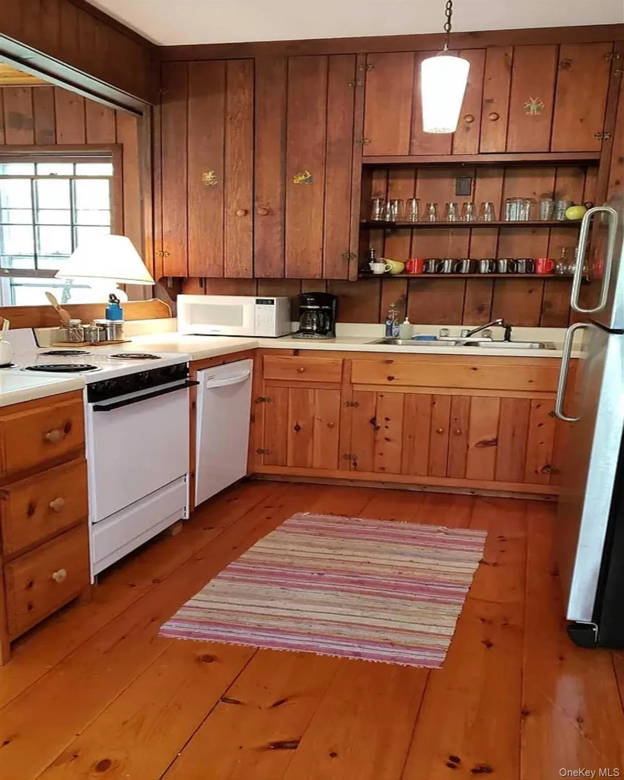 Functional kitchen with natural wood and modern accents Functional kitchen with natural wood and modern accents