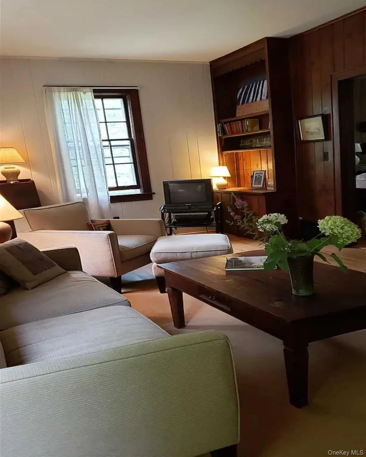 Living area with wooden walls and great light! Living area with wooden walls and great light!