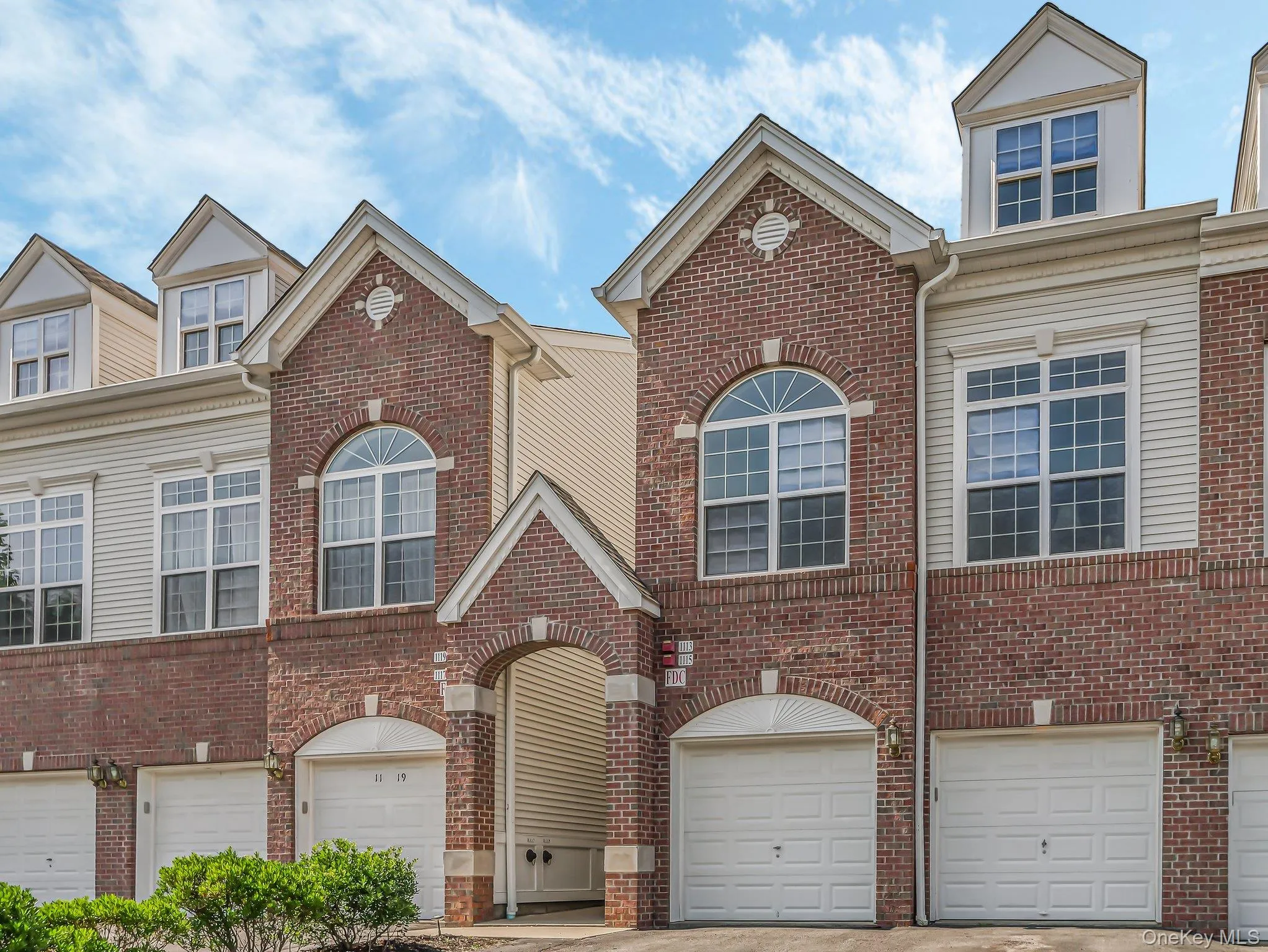 Traditional-style home with an attached garage and brick siding Traditional-style home with an attached garage and brick siding
