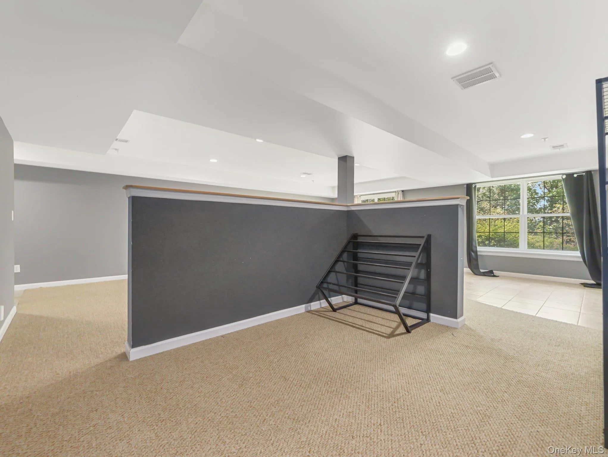 Bonus room featuring light carpet and recessed lighting Bonus room featuring light carpet and recessed lighting