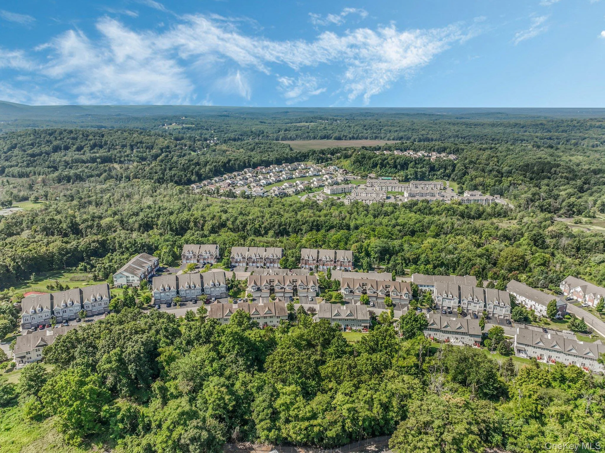 Aerial view of property's location with nearby suburban area Aerial view of property's location with nearby suburban area