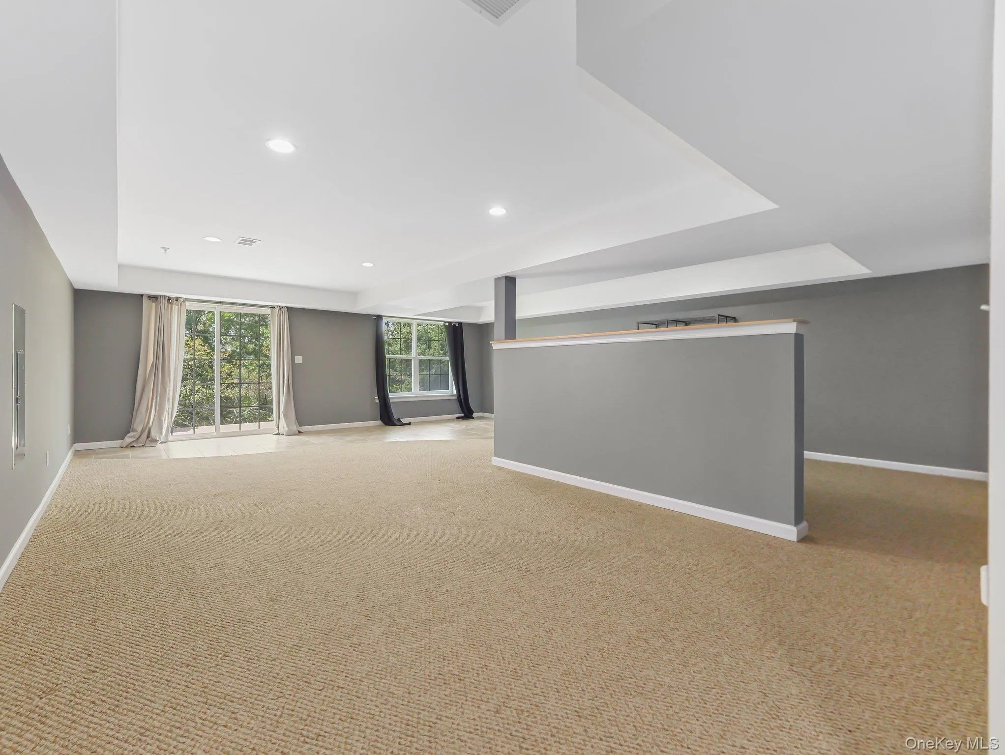Unfurnished room featuring carpet and recessed lighting Unfurnished room featuring carpet and recessed lighting