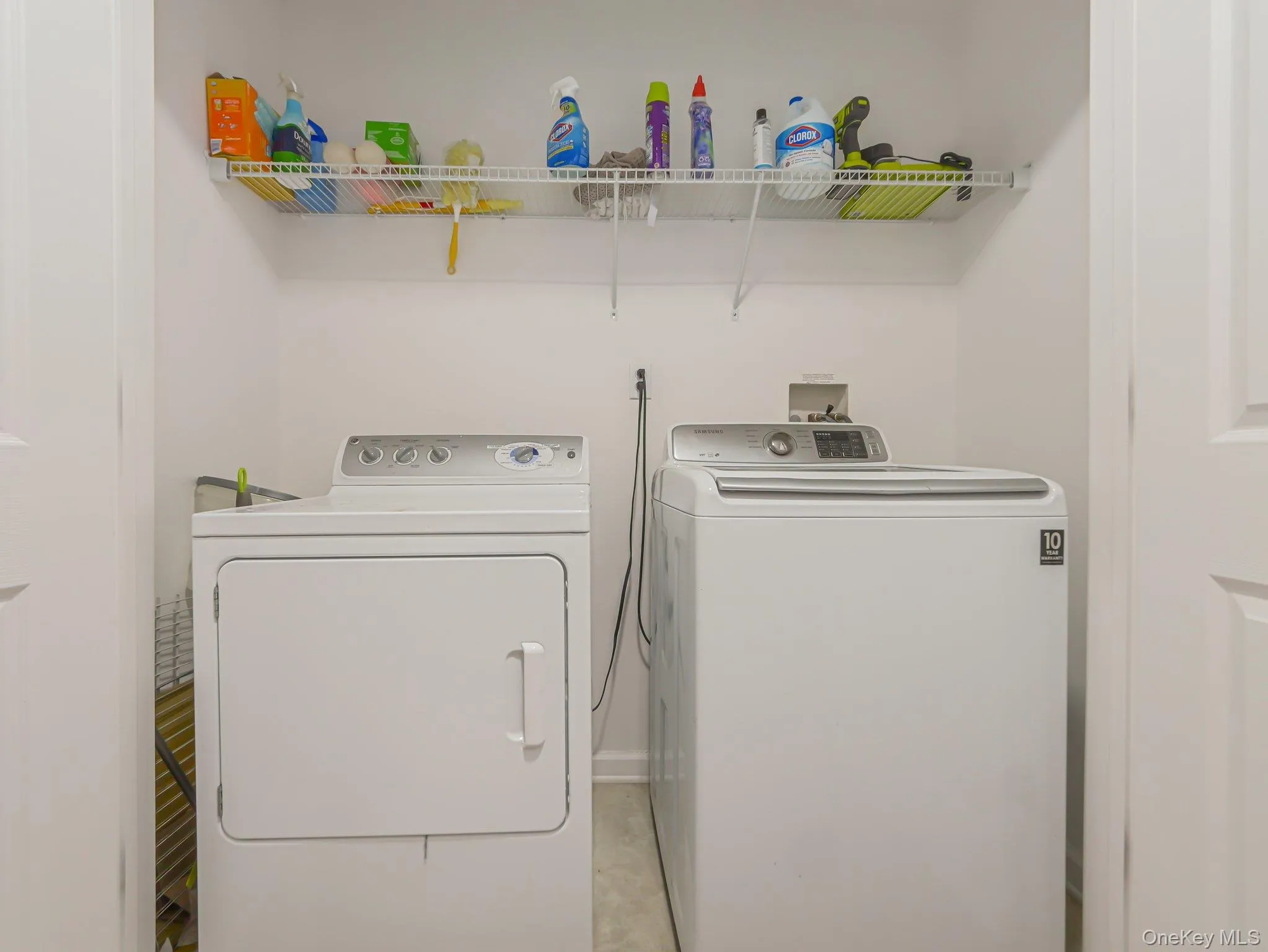 Washroom with washing machine and clothes dryer Washroom with washing machine and clothes dryer