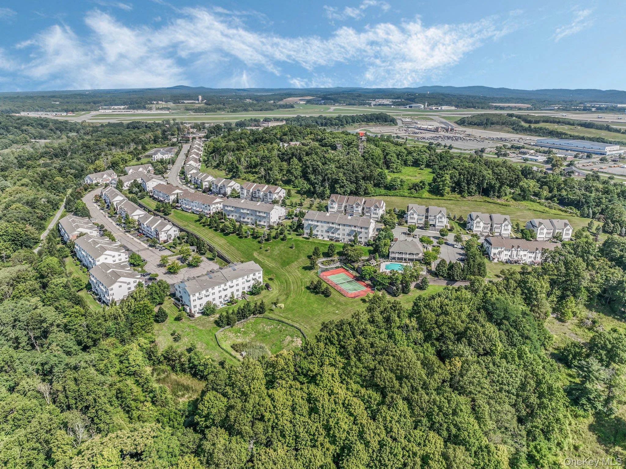 Aerial overview of property's location featuring a tree filled landscape Aerial overview of property's location featuring a tree filled landscape